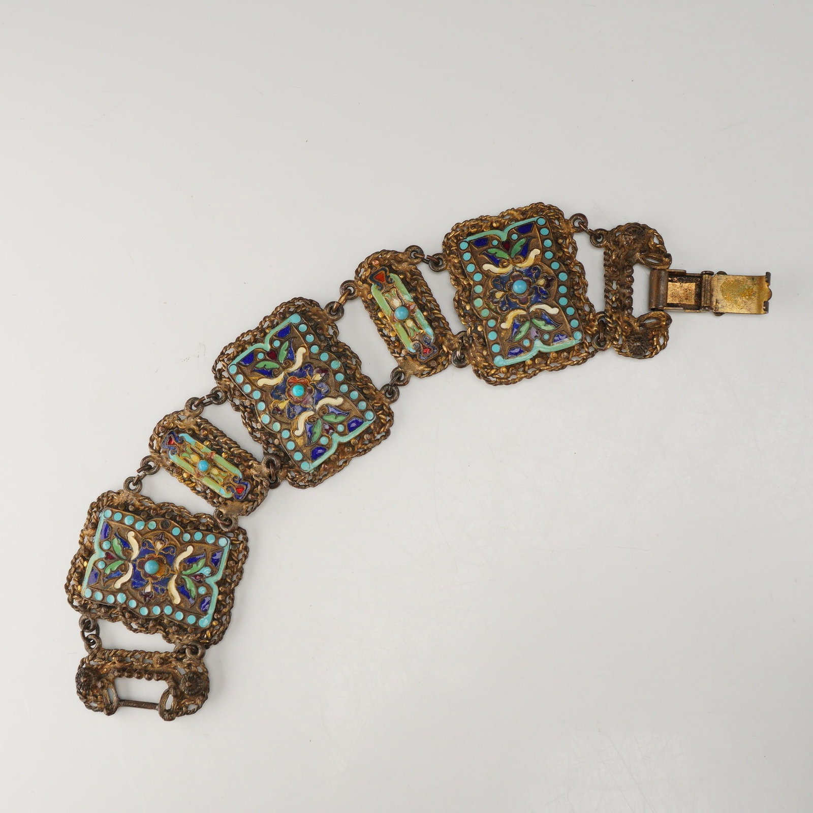 Persian Crafts 925 Sterling Silver Enamel and Filigree Link Bracelet: This link bracelet is produced by Persian Crafts and is constructed from 925 sterling silver. The piece features a Middle Eastern design aesthetic, consisting of five large rectangular links and two s