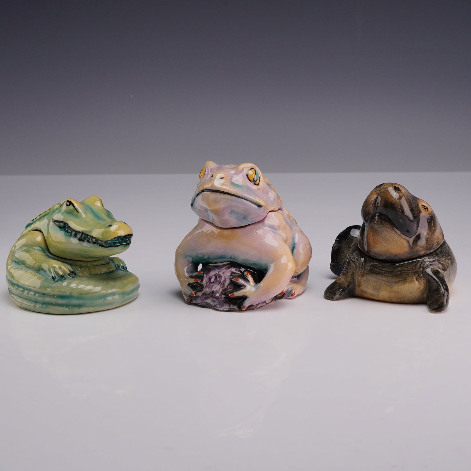 Three Kevin Francis Face Pots, Aquatic Animals including Florida Gator Artist Edition: The first item is the Florida Gator, featuring a stylized alligator in green and yellow glazes; the base is marked Artists Edition and the interior is inscribed Florida Gator and Exclusive to Victoria