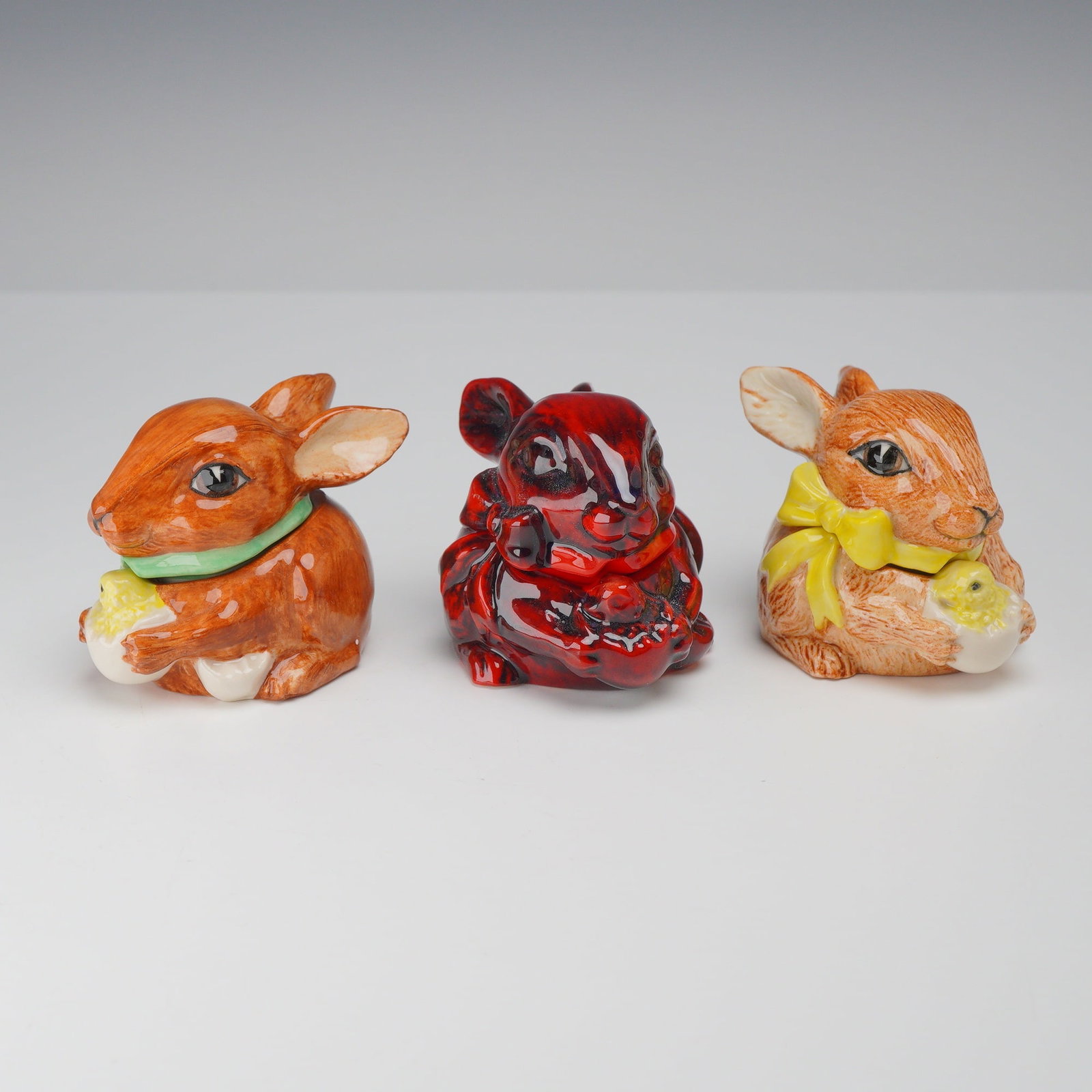 3pc Kevin Francis Ceramic Bunny Face Pots: This is a trio of Kevin Francis ceramic Face Pot figurines in the form of rabbits, dated 2001. Each item is designed as a small two-part lidded container, with the rabbit head serving as the removable