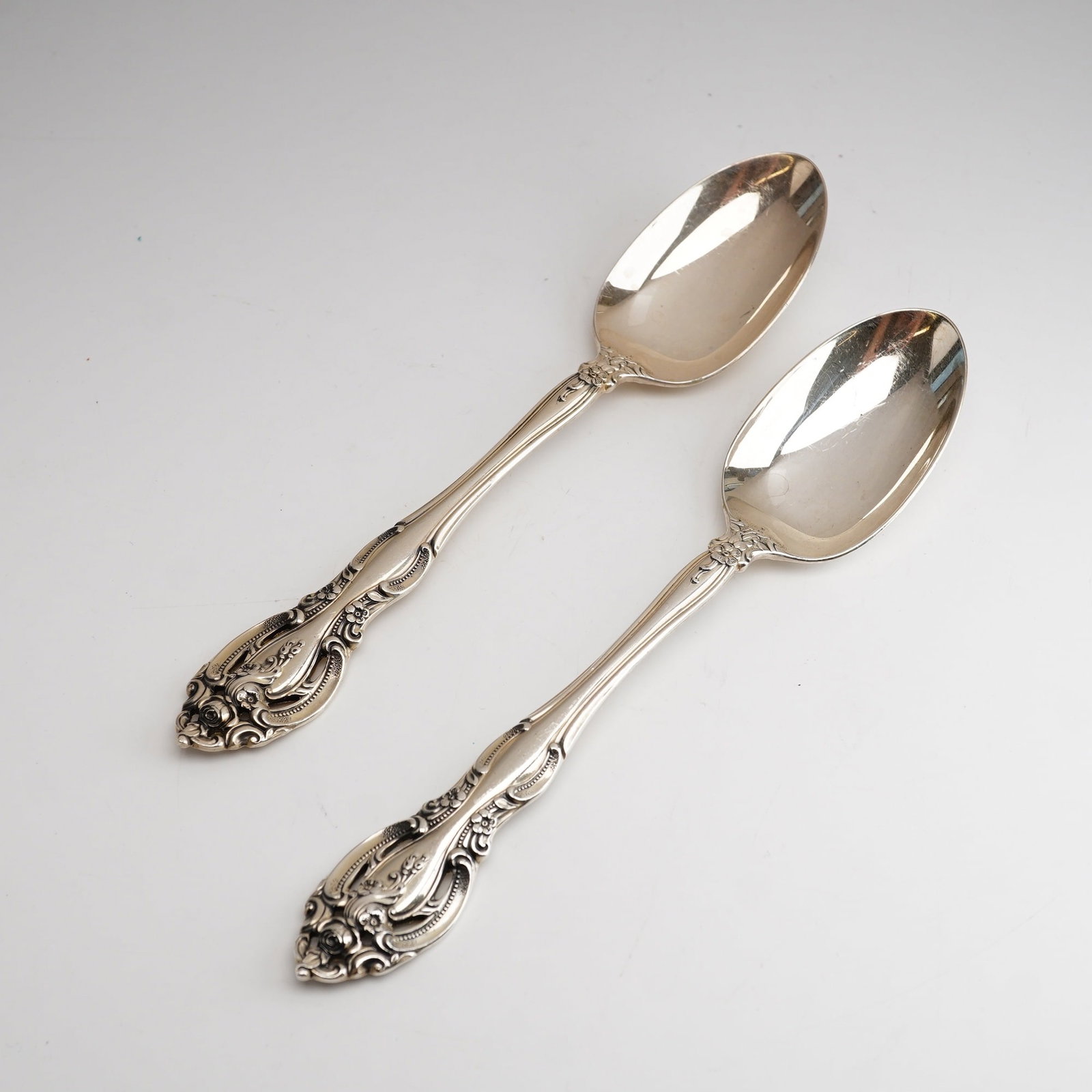 2pc Gorham Sterling Silver Teaspoon, La Scala: The spoons are designed in the La Scala pattern, a Rococo-revival style introduced by Gorham in 1964. The pattern is distinguished by its elaborate relief casting and significant openwork piercing at 