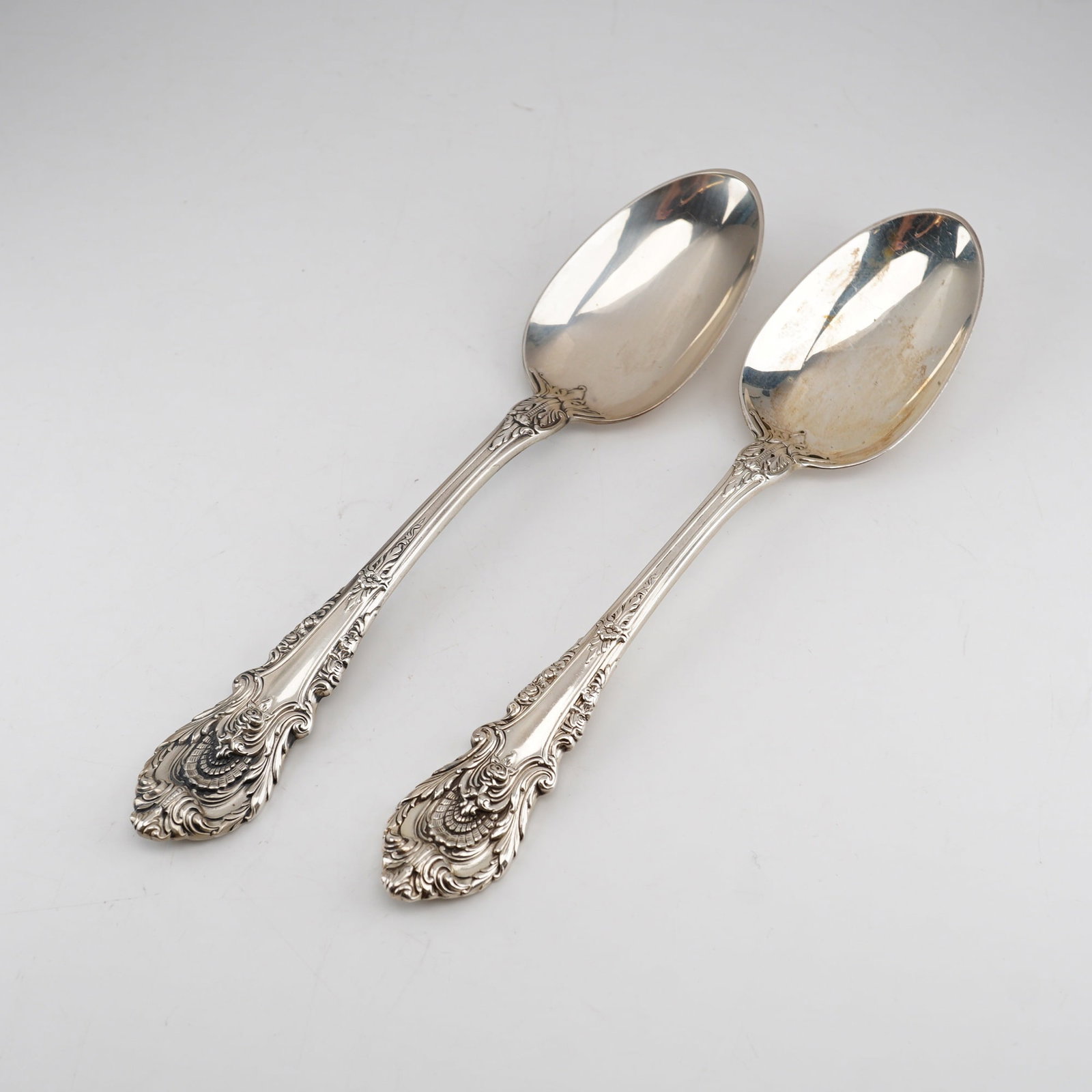 2pc Wallace Sterling Silver Dessert Spoons, Sir Christopher Pattern: These items were manufactured by Wallace Silversmiths of Wallingford, Connecticut. The Sir Christopher pattern, introduced in 1936 and designed by William S. Warren, is a highly decorative Rococo-revi