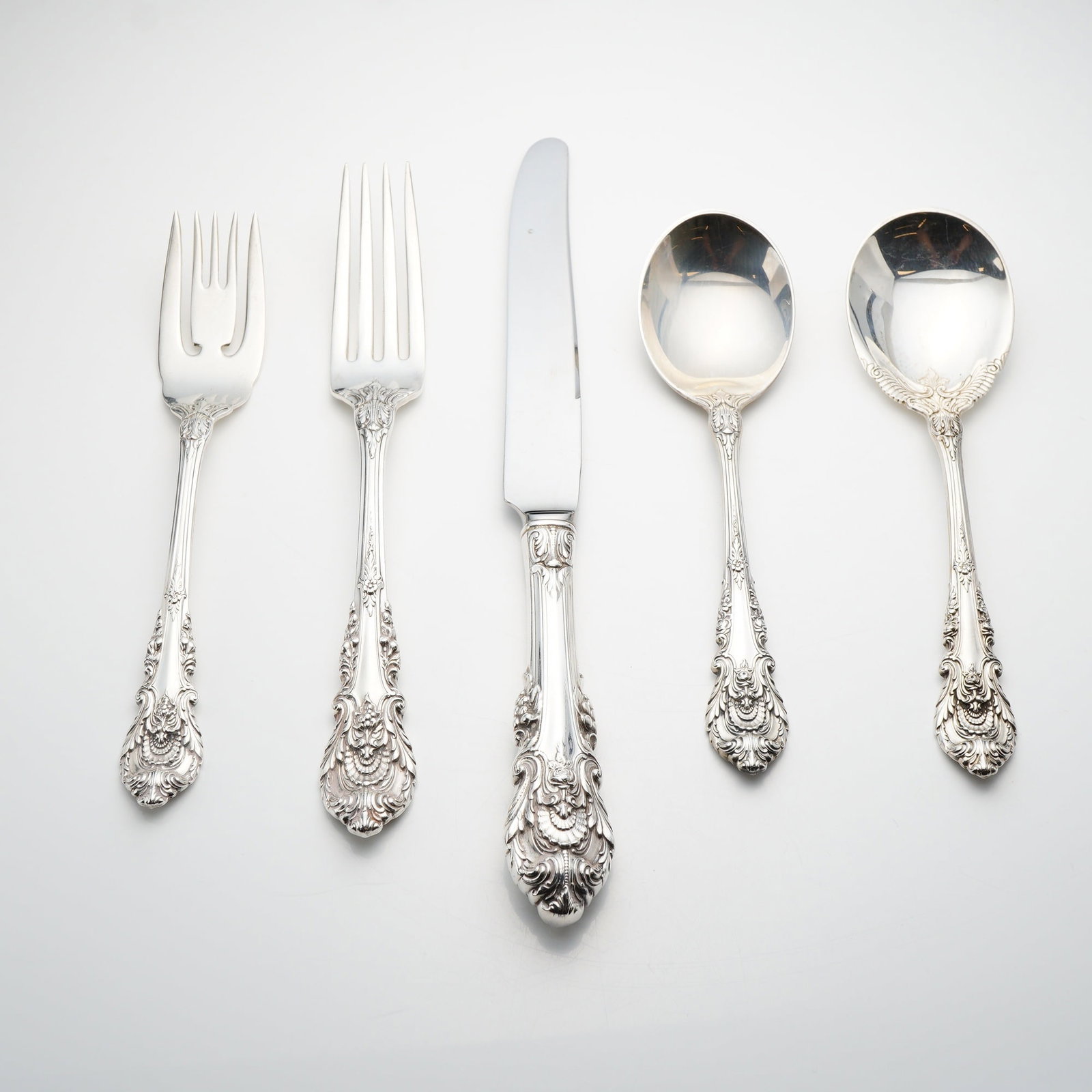 5pc Wallace Sir Christopher Sterling Silver Flatware Grouping: A five-piece grouping of sterling silver flatware in the Sir Christopher pattern by Wallace Silversmiths. This highly ornate pattern, introduced in 1936, features a Renaissance-inspired design charact
