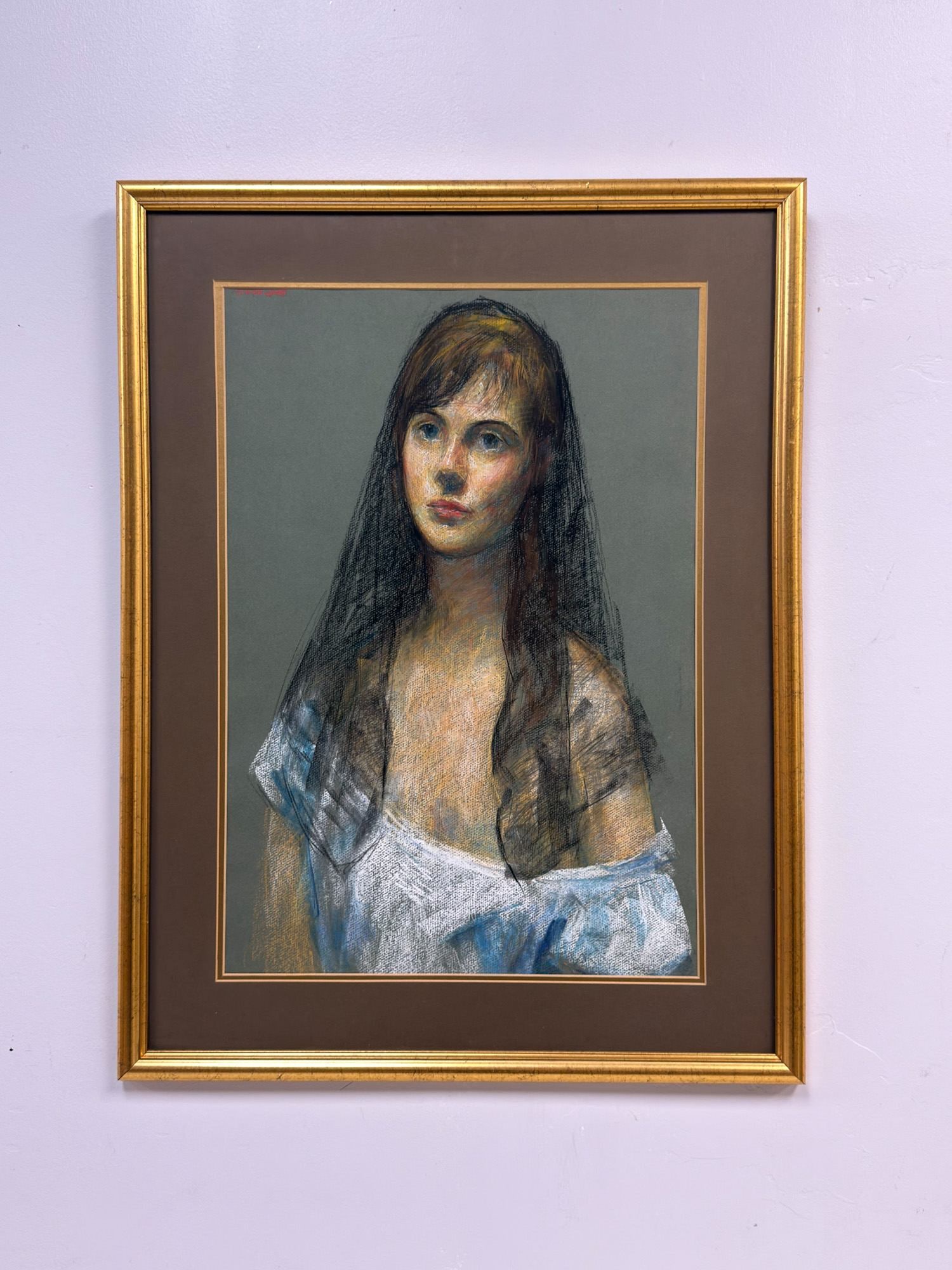 Thomas Strickland (American 1932-1999) Pastel on Paper, Portrait of a Woman, Signed: This realist portrait of a young woman is the work of artist Thomas Strickland, executed in pastel and charcoal on toned gray-green wove paper. The subject is portrayed wearing a dark, lace-like veil 
