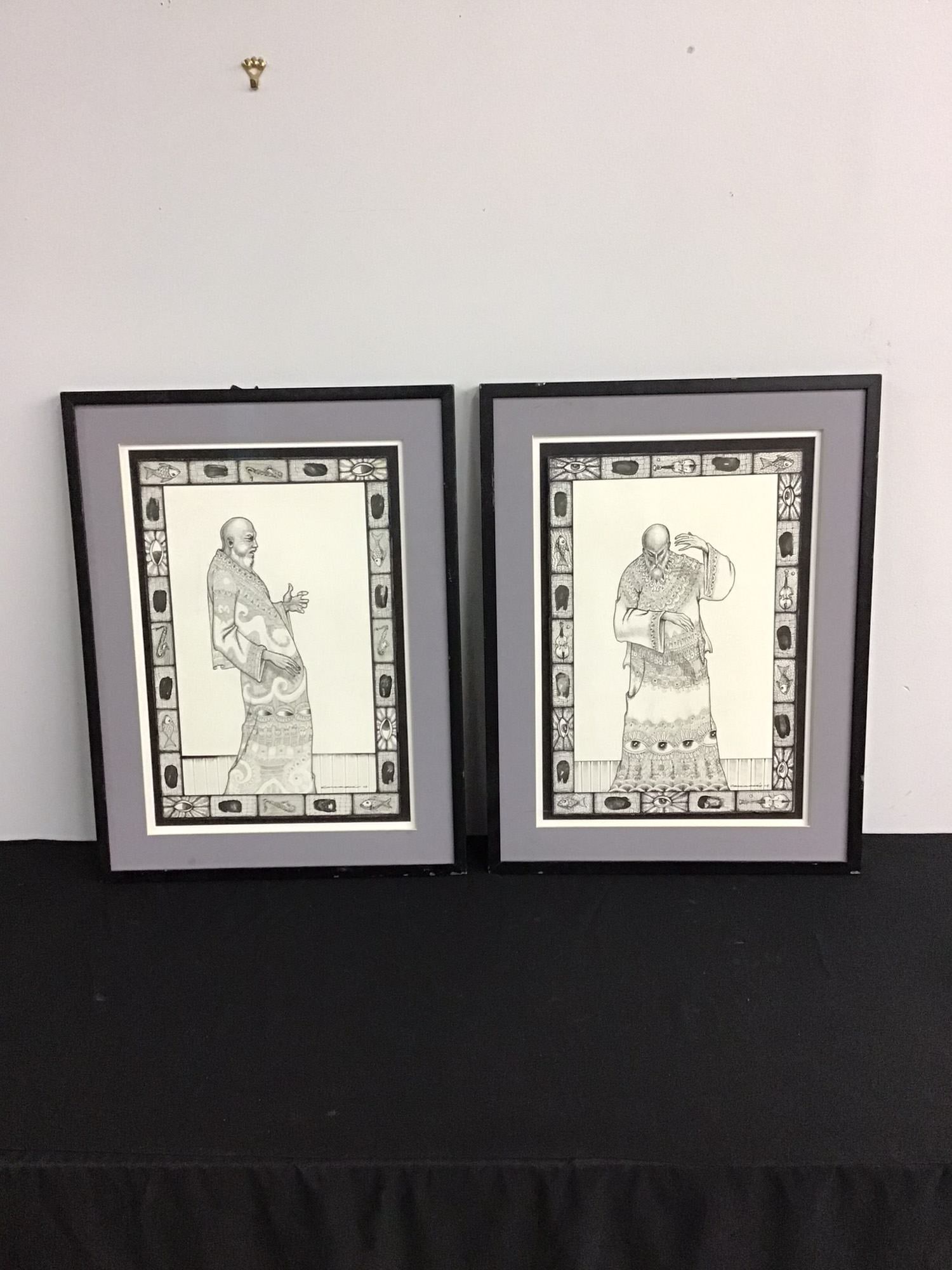 Yanelis Matos (Cuban, 20th/21st Century), A Pair of Surrealist Figures (Signed): Yanelis Matos (Cuban, 20th/21st Century). A pair of original pen and ink drawings on smooth white wove paper applied to cardboard. These intricate works feature a surrealist aesthetic with meticulous 