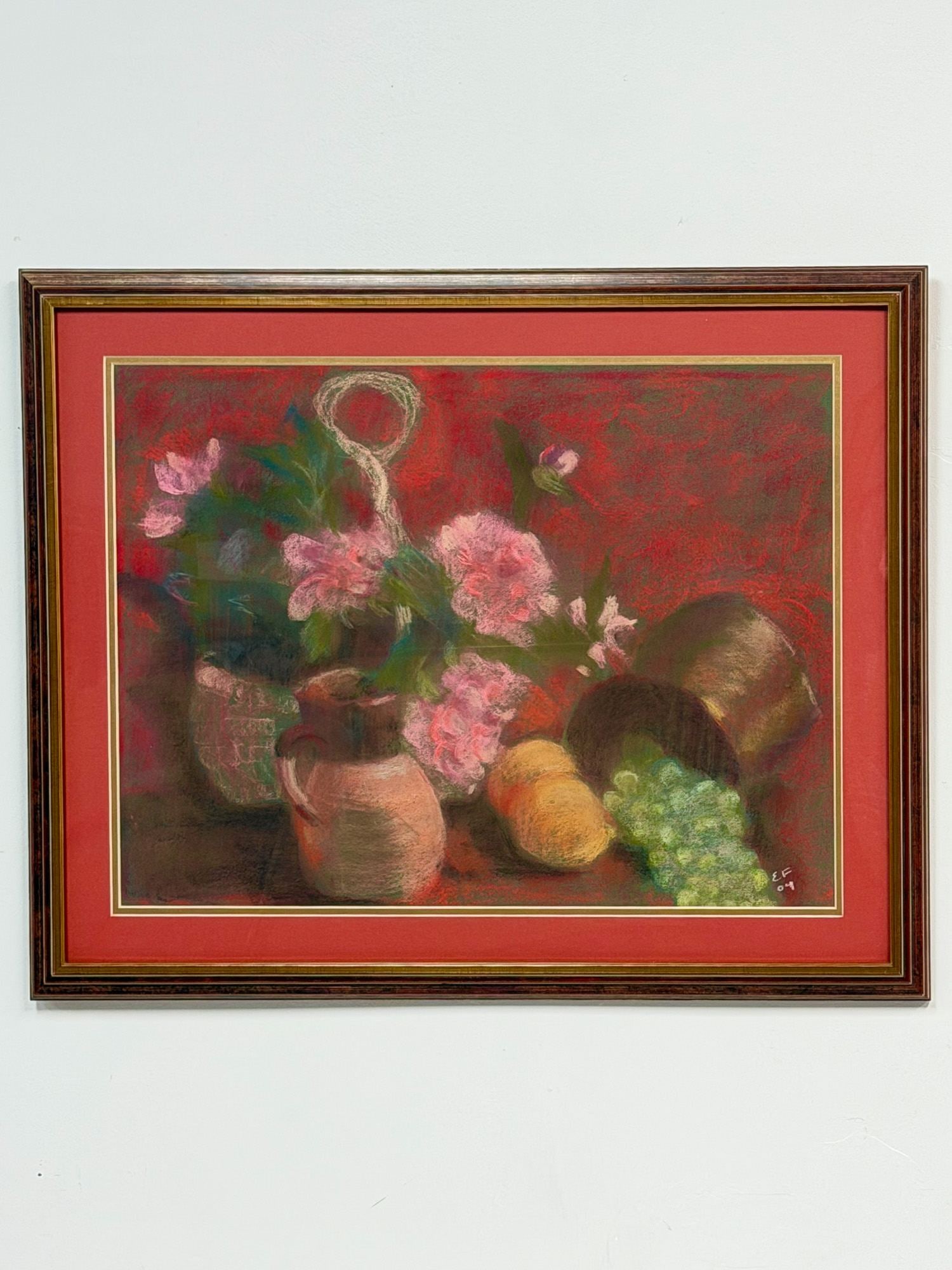 Original Pastel on Paper, Still Life with Flowers and Fruit, Signed: This still-life drawing is executed in pastel on heavy wove paper. The composition features an arrangement of pink flowers in a vessel, a terracotta pitcher, a piece of yellow fruit, and a cluster of 