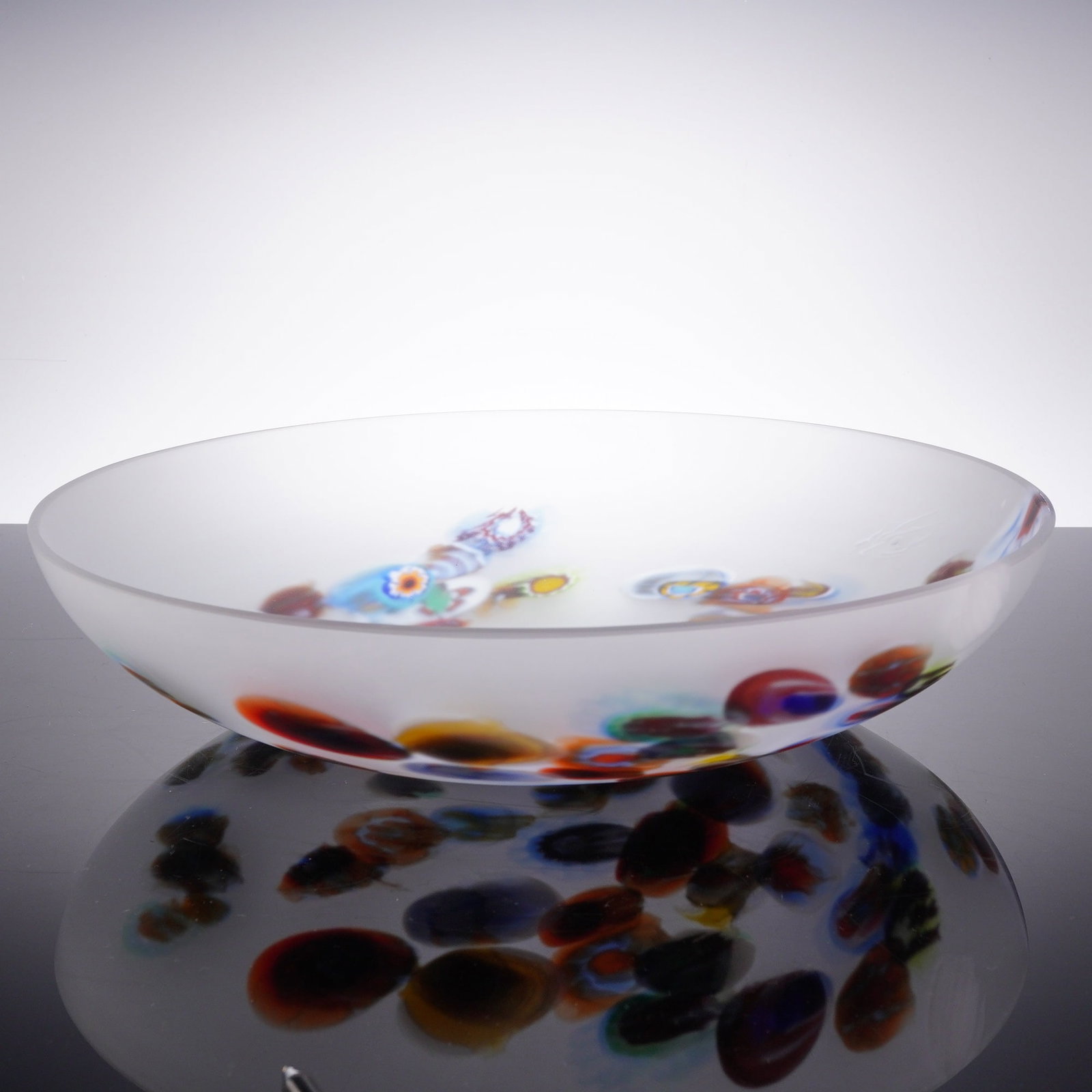 Large Millefiori Frosted Glass Centerpiece Bowl: A large console table bowl in frosted glass with millefiori internal decoration. The piece is a shallow circular bowl with a rounded profile and a wide, open rim. The glass body features a satin-frost