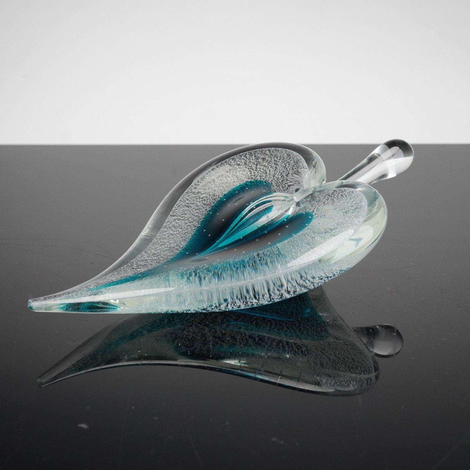 Michael Nourot Art Glass Heart Perfume Bottle and Stopper: This hand-blown art glass perfume bottle and matching stopper are the work of Michael Nourot. The vessel is designed in a stylized heart form and features a turquoise blue interior core. This core is 