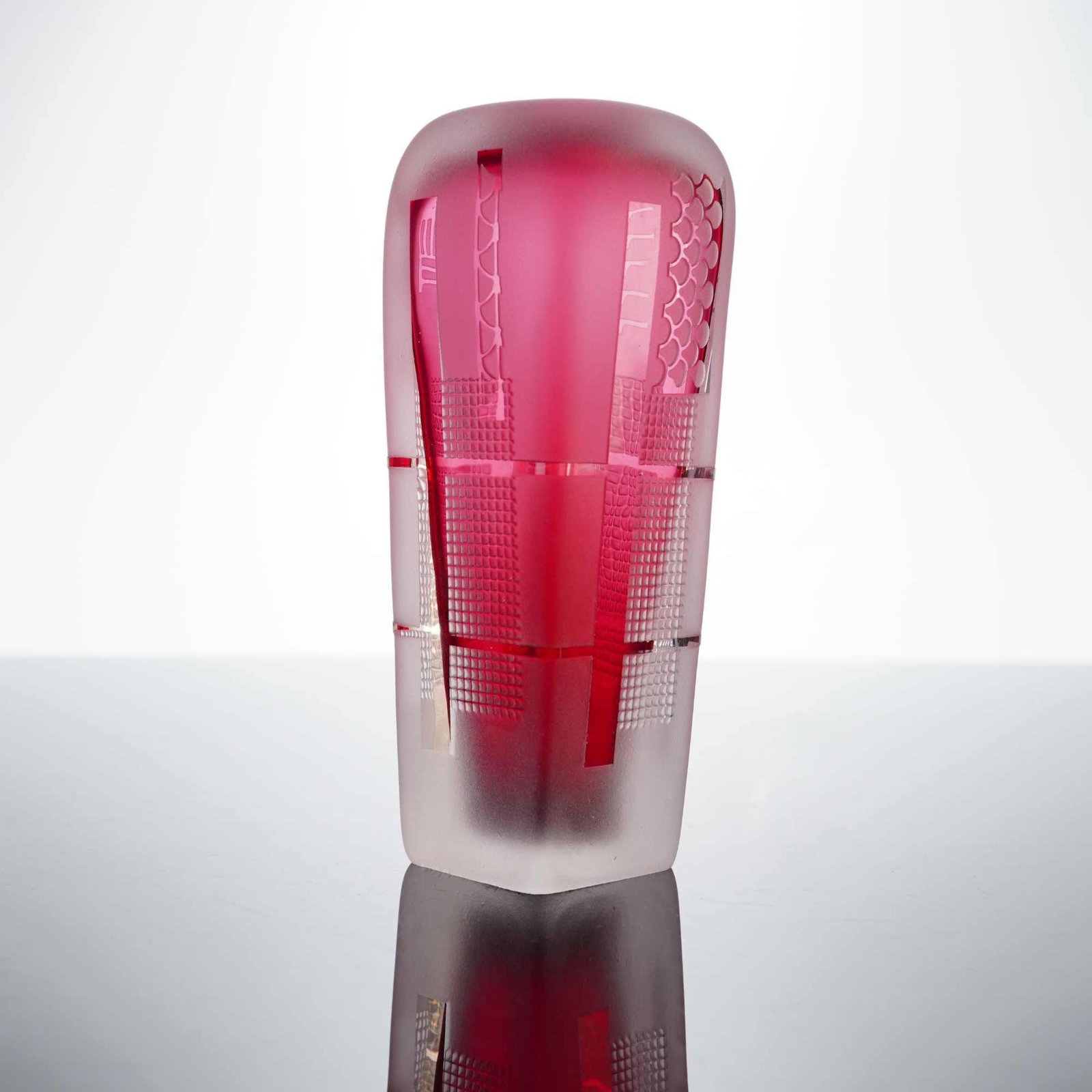 Modern Grant Studio Frosted Glass Perfume Bottle: A modern studio art glass perfume bottle by Modern Grant Studio, featuring a construction with a ruby red interior core encased in thick clear glass. The exterior is finished with a matte, frosted sur