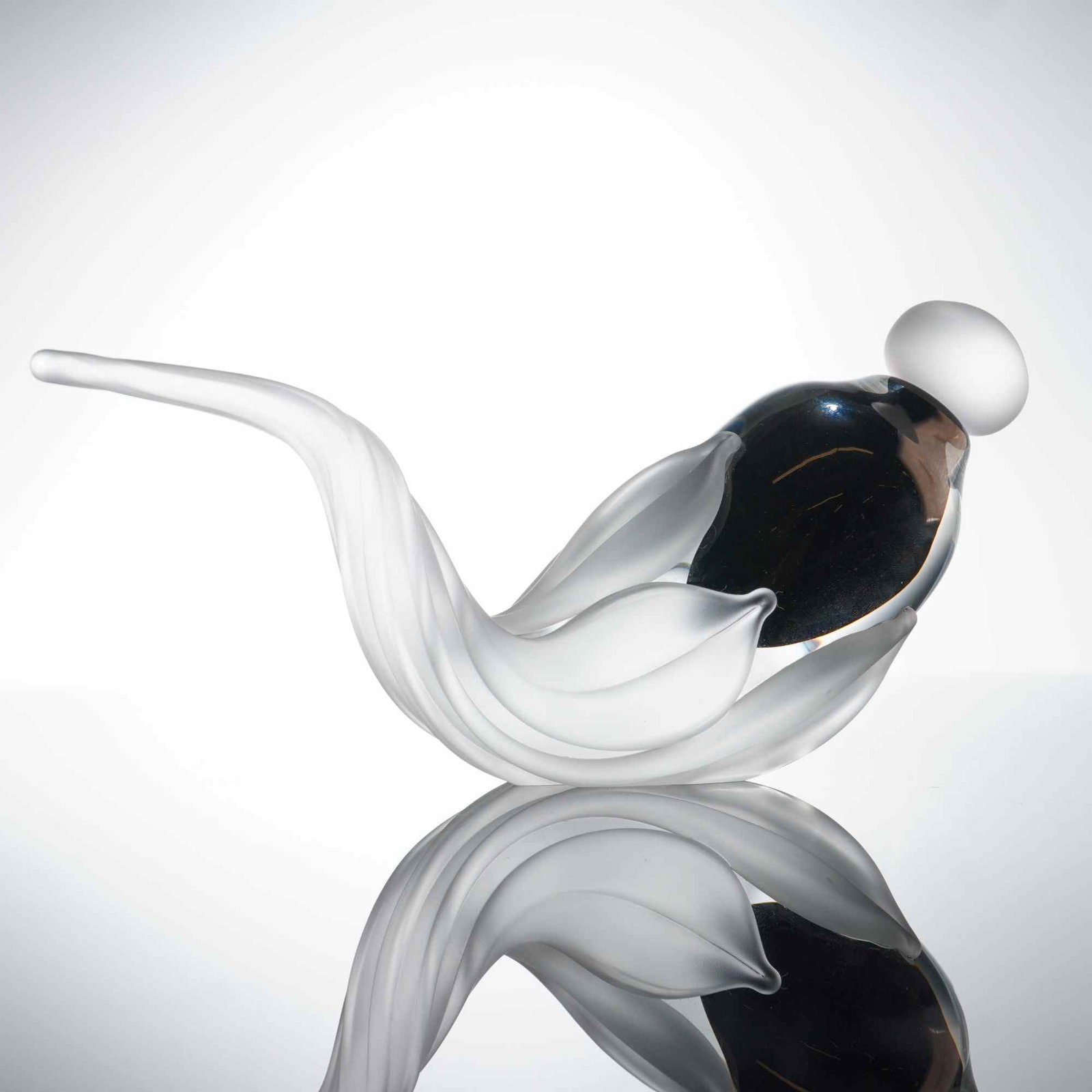 William Glasner Frosted Leaf Studio Art Glass Perfume Bottle and Stopper: The vessel features an organic form consisting of a central, polished dark glass core enveloped by multiple frosted translucent glass structures resembling leaves. The form tapers into a long, curved,