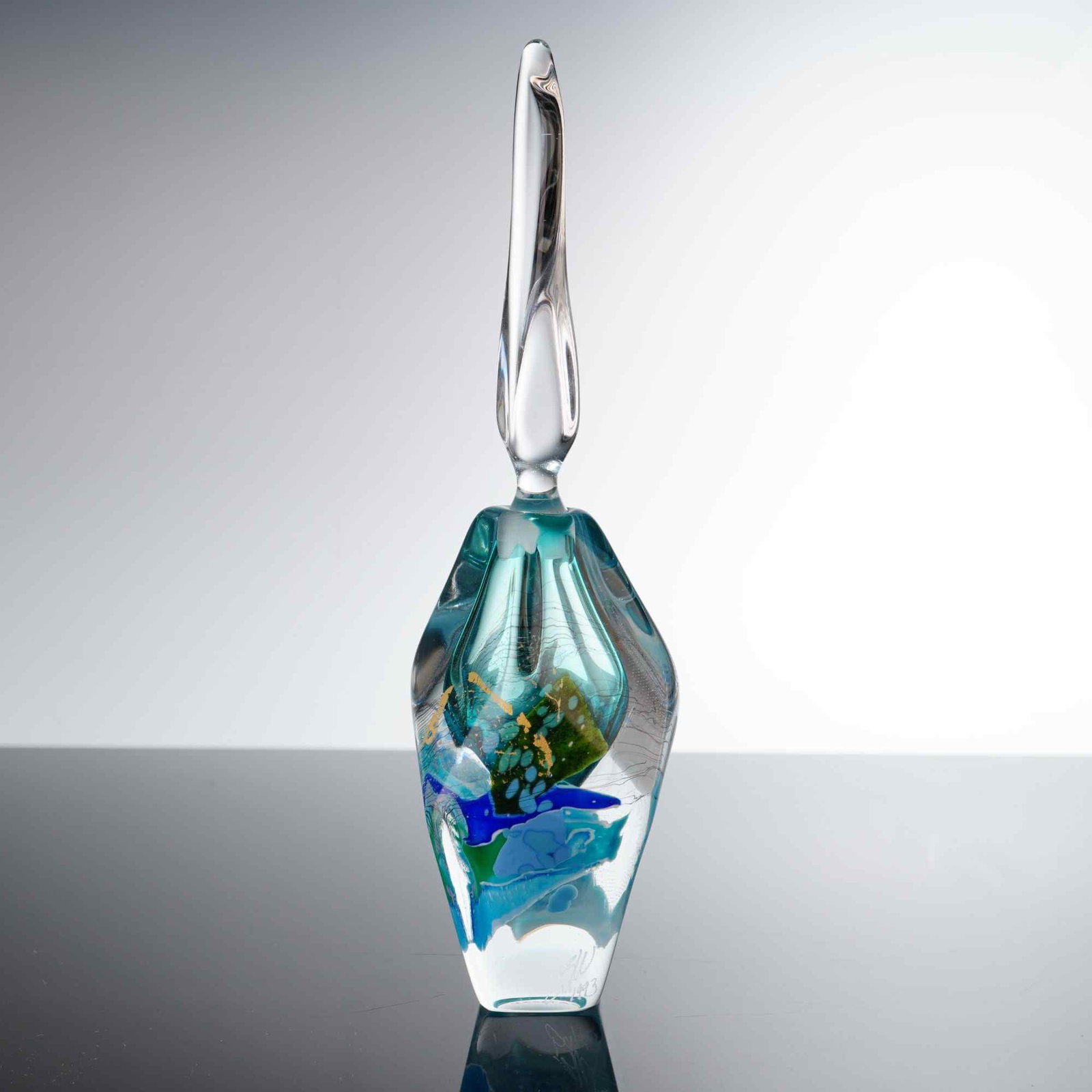 Studio Art Glass Bottle and Stopper: This contemporary hand-blown studio art glass perfume bottle, dated 1993, features an organically formed, asymmetrical vessel crafted with thick-walled glass. The design is energized by vibrant splash