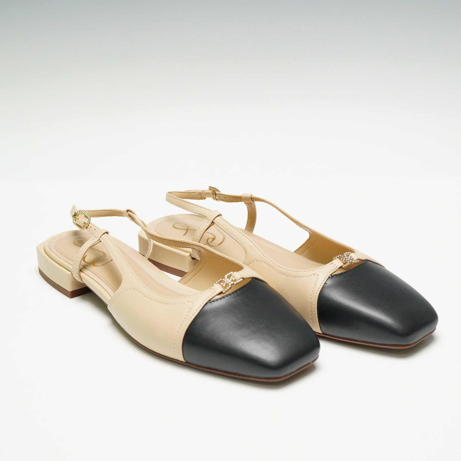 Sam Edelman Kara 2 Square Toe Slingback Flats Sand/Black: Feature a square cap-toe design executed in contrasting Summer Sand (nude/beige) and black material, likely leather. The style includes a very low stacked rectangular heel and an adjustable slingback 