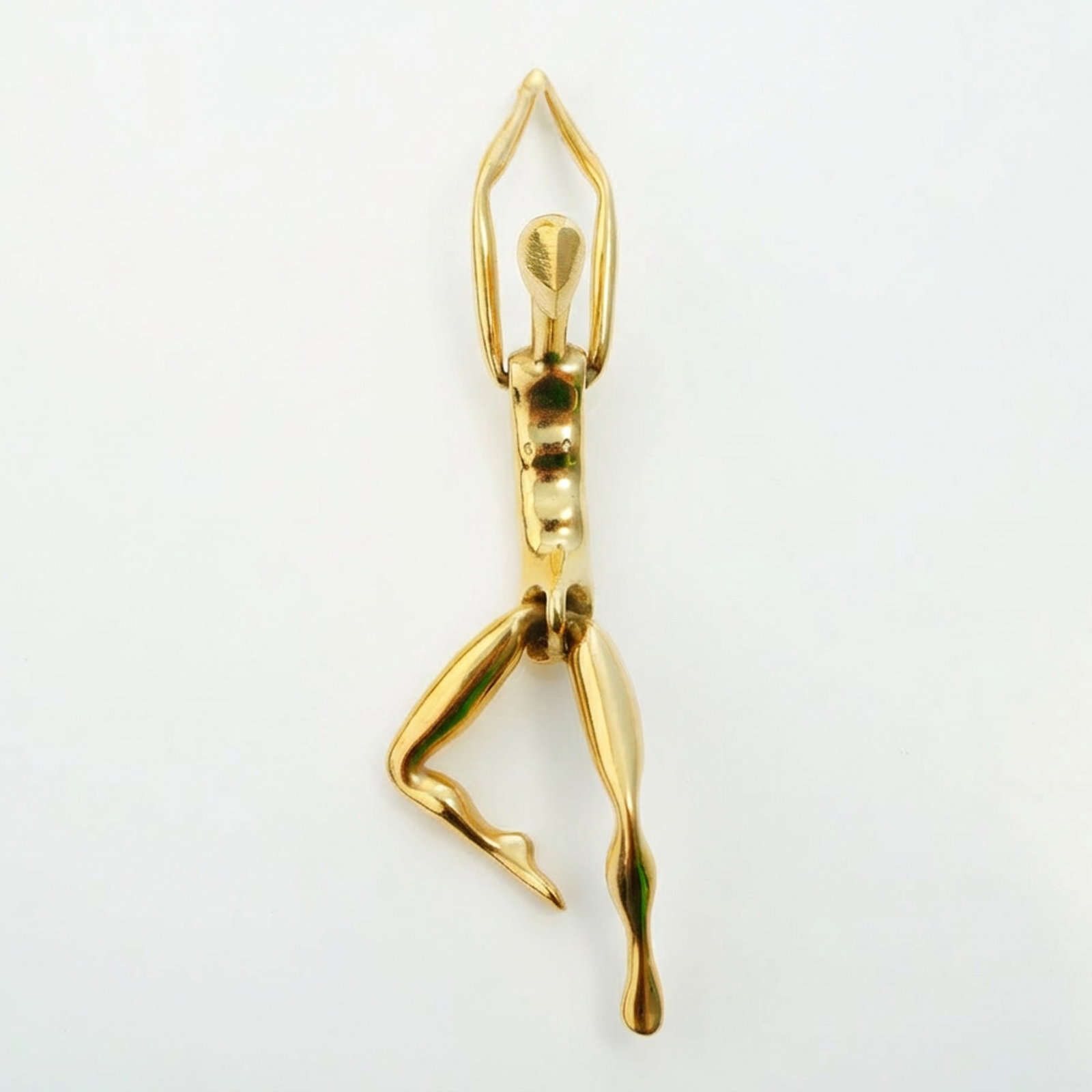 Charles Jourdan Paris Large Gold-Plated Articulated Figurine Pendant: A single articulated figurative pendant by Charles Jourdan. The piece is constructed from highly polished gold-plated metal, depicting a minimalist human figure in a modern, abstract style. The figure