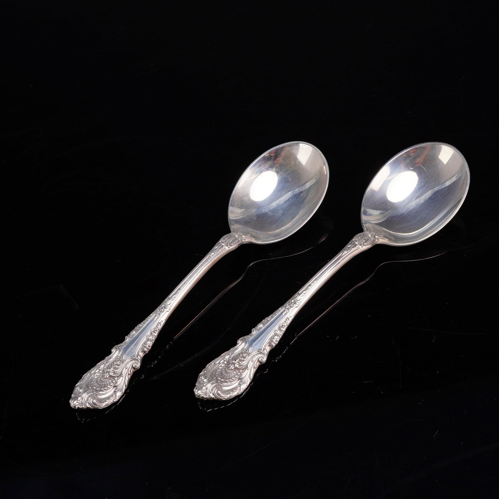 2pc Wallace Sterling Silver Sir Christopher Pattern Soup Spoons: This set includes two Wallace Silversmiths soup spoons in the Sir Christopher pattern. Crafted from .925 sterling silver, these spoons feature round bowls and handles decorated in a Renaissance-influe