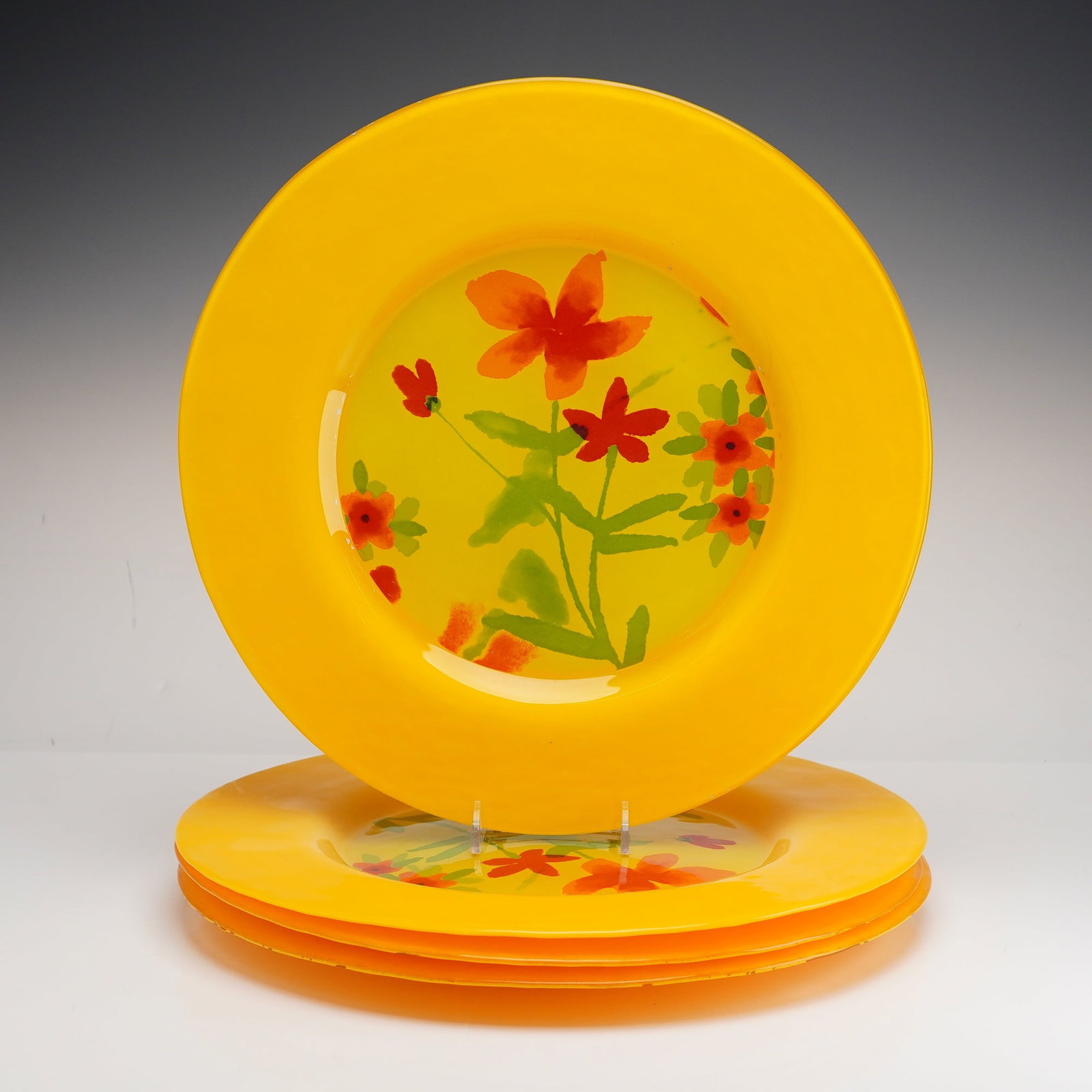 Set of Four Dibbern Germany Yellow Glass Plates, Kristina Pattern: This set of four large glass plates was produced by Dibbern of Germany in the Kristina pattern for Crate and Barrel. The plates are crafted using fused and slumped studio glass techniques. Each plate 