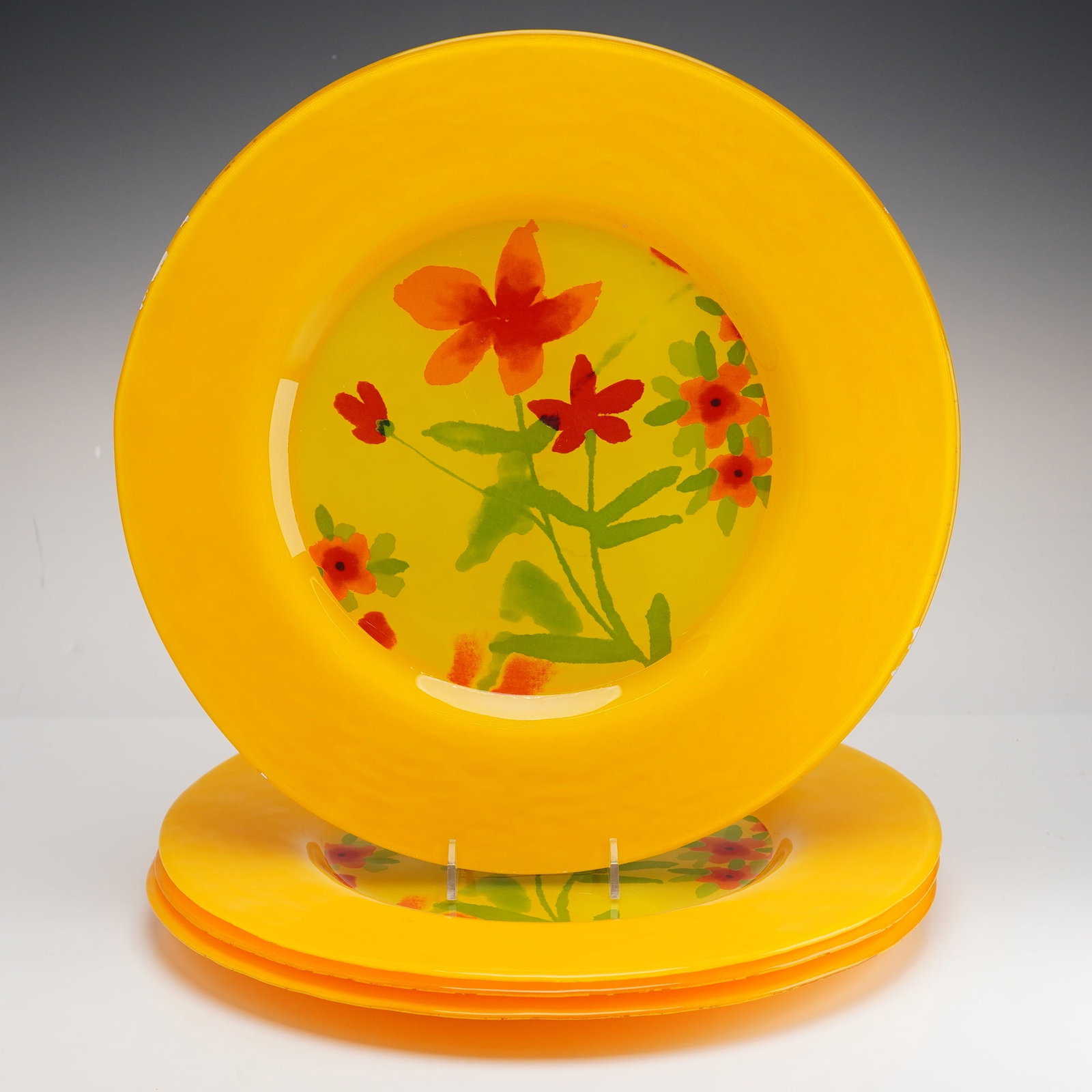 Set of Four Dibbern Germany Yellow Glass Plates, Kristina Pattern: A set of four large glass plates in the Kristina pattern, manufactured by Dibbern for Crate and Barrel. Each plate is constructed of hand-blown glass featuring a wide, opaque yellow rim and a transluc