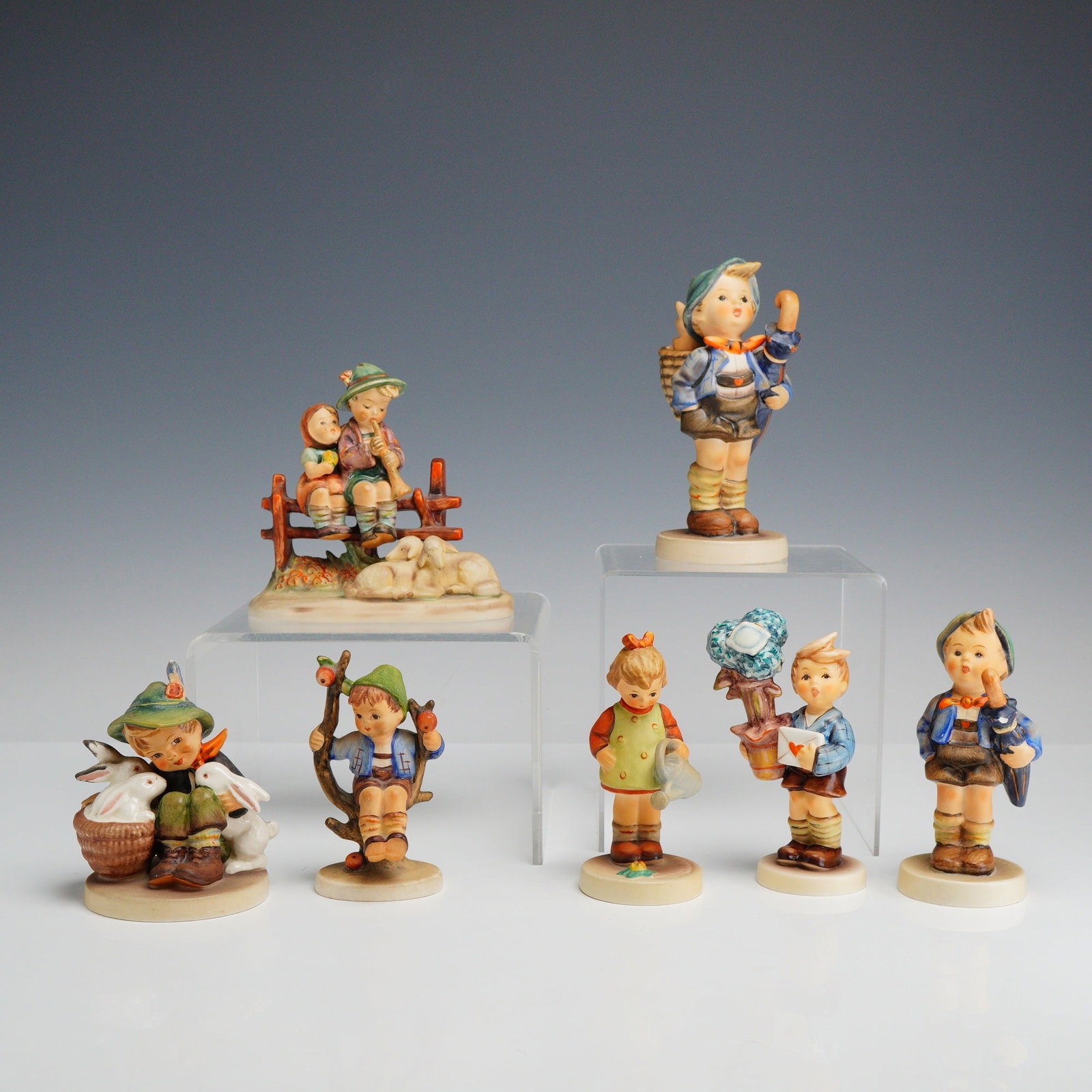 A Collection of 7 Goebel M.J. Hummel Ceramic Figurines (1 of 3)
