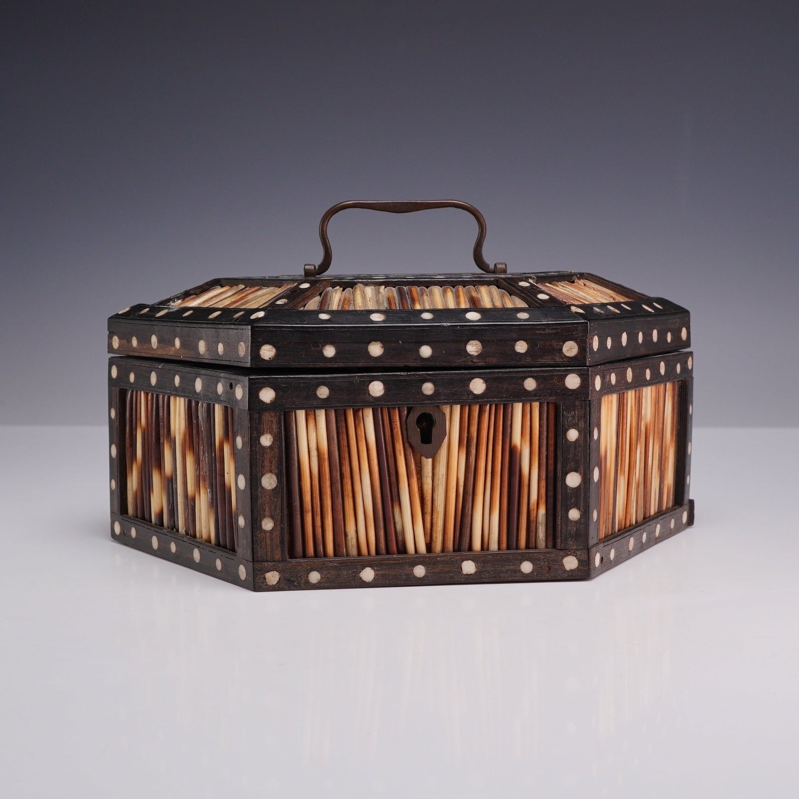 19th Century British Colonial Ceylonese Porcupine Quill and Ebony Hexagonal Box: This 19th-century Ceylonese hexagonal porcupine quill and ebony box is an example of British Colonial era craftsmanship from the port city of Galle, Sri Lanka. The exterior is constructed with vertica