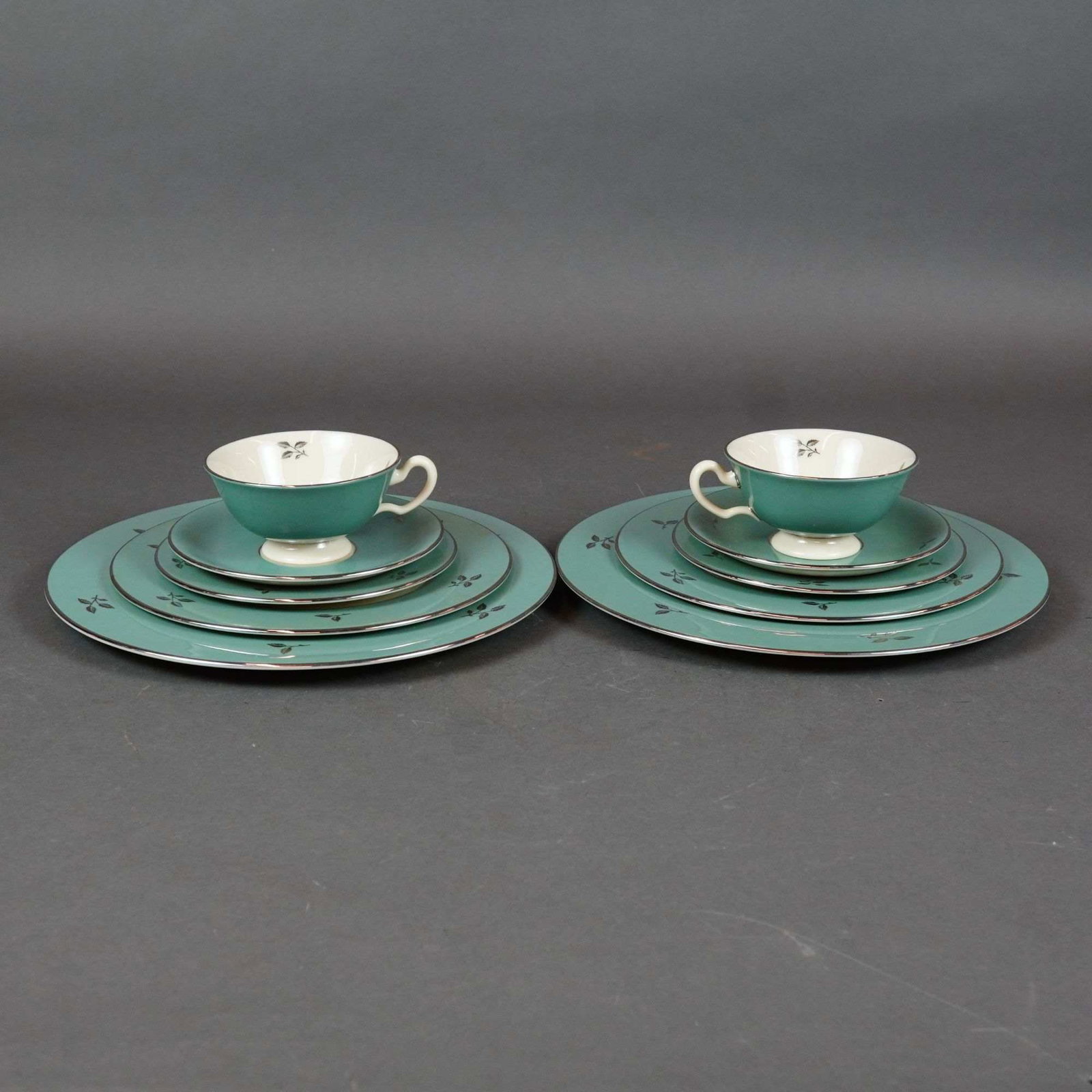 10pc Lenox Porcelain Tea Service Set, Duet: This ten-piece Lenox partial dinner service in the Duet (E 550) pattern features creamy white centers framed by wide teal borders. Each piece is embellished with platinum-finished rims and stylized pl