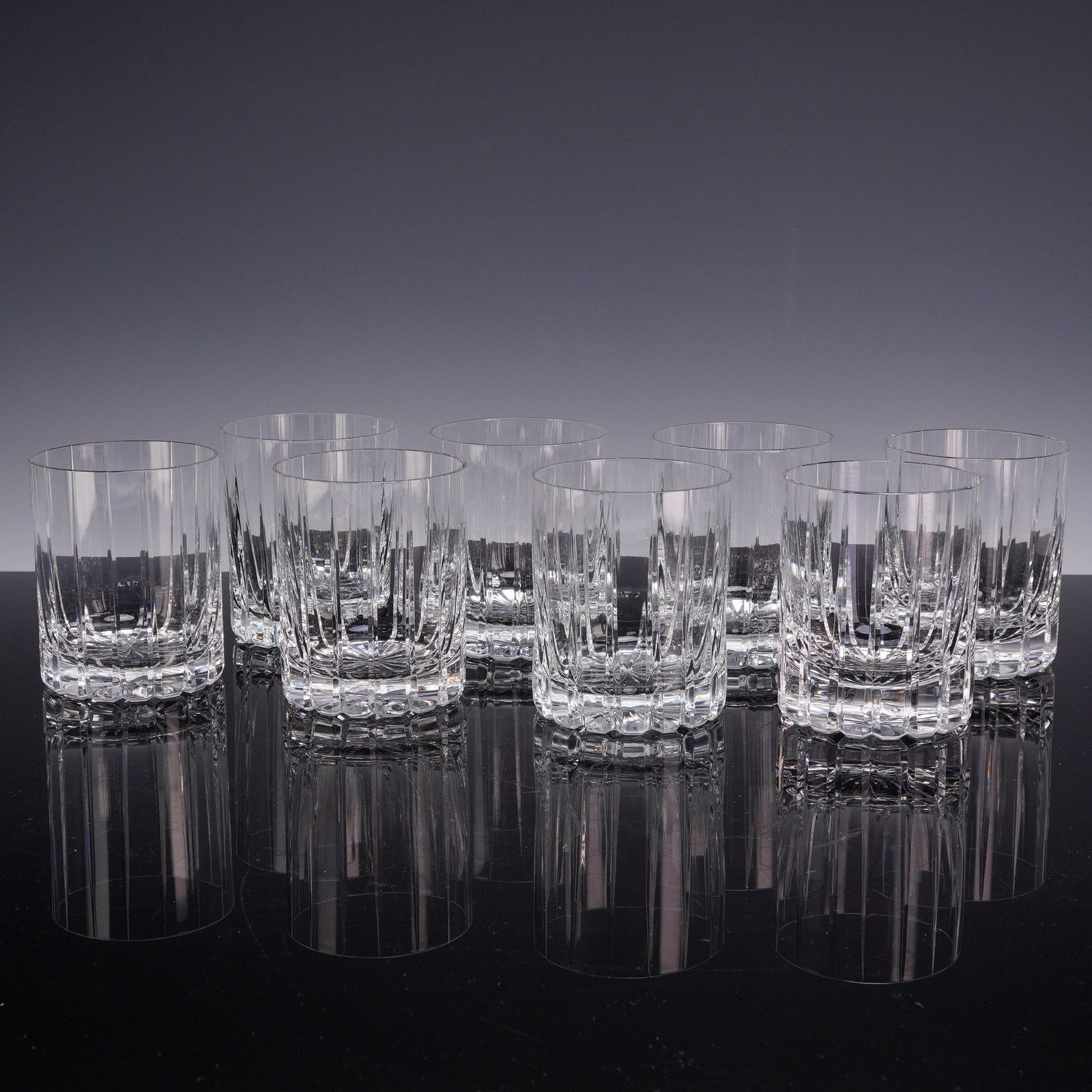 8pc Cut Lead Crystal Double Old Fashioned Whiskey Tumblers: This set of eight double old fashioned whiskey tumblers is crafted from high-clarity lead crystal, characterized by significant weight and a high refractive index. Each glass features a cylindrical fo