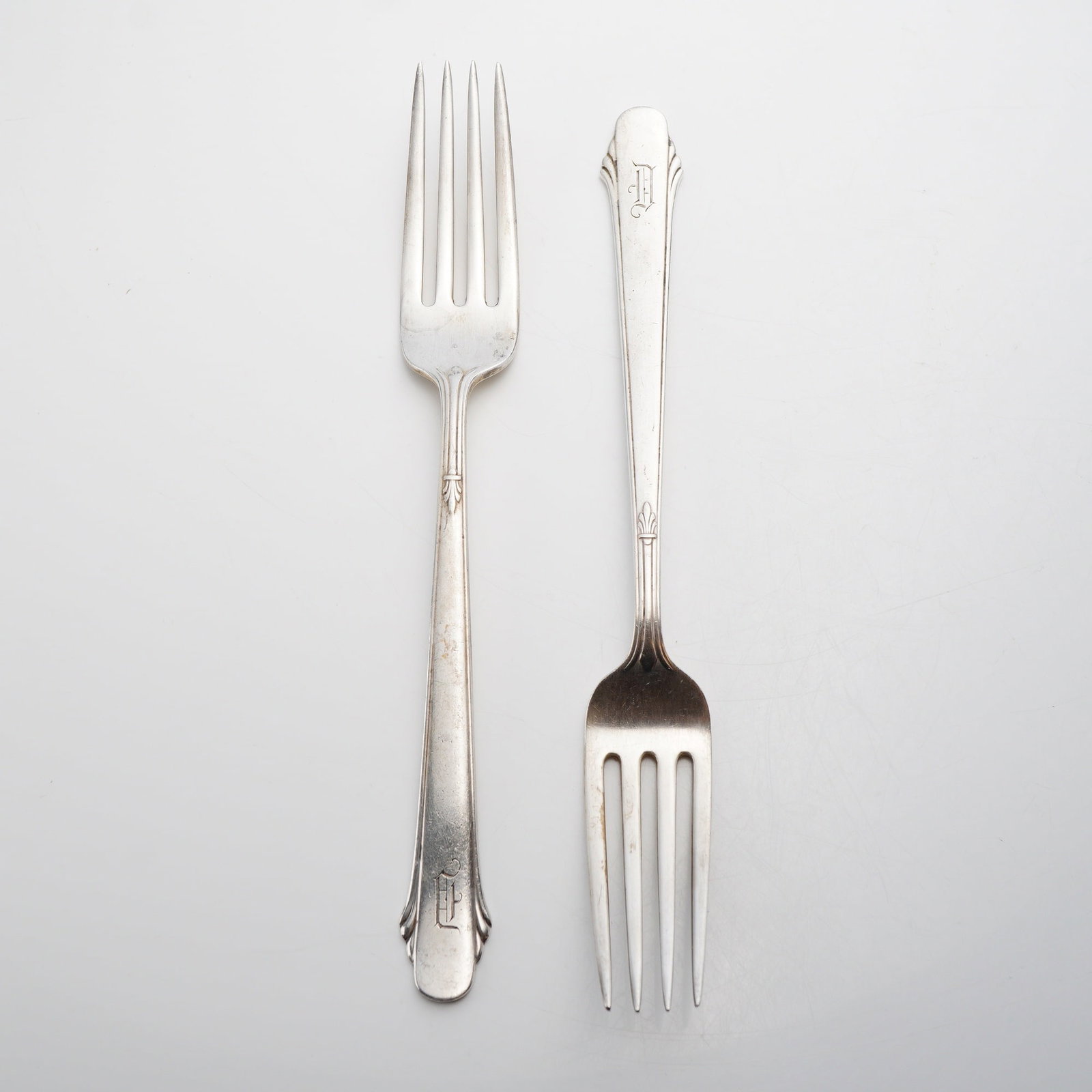 Pair of Gorham Sterling Silver Forks, Hunt Club Pattern: A lot of two sterling silver forks manufactured by the Gorham Manufacturing Company. The lot consists of one dinner fork and one smaller salad or dessert fork. Both pieces are in the Hunt Club pattern