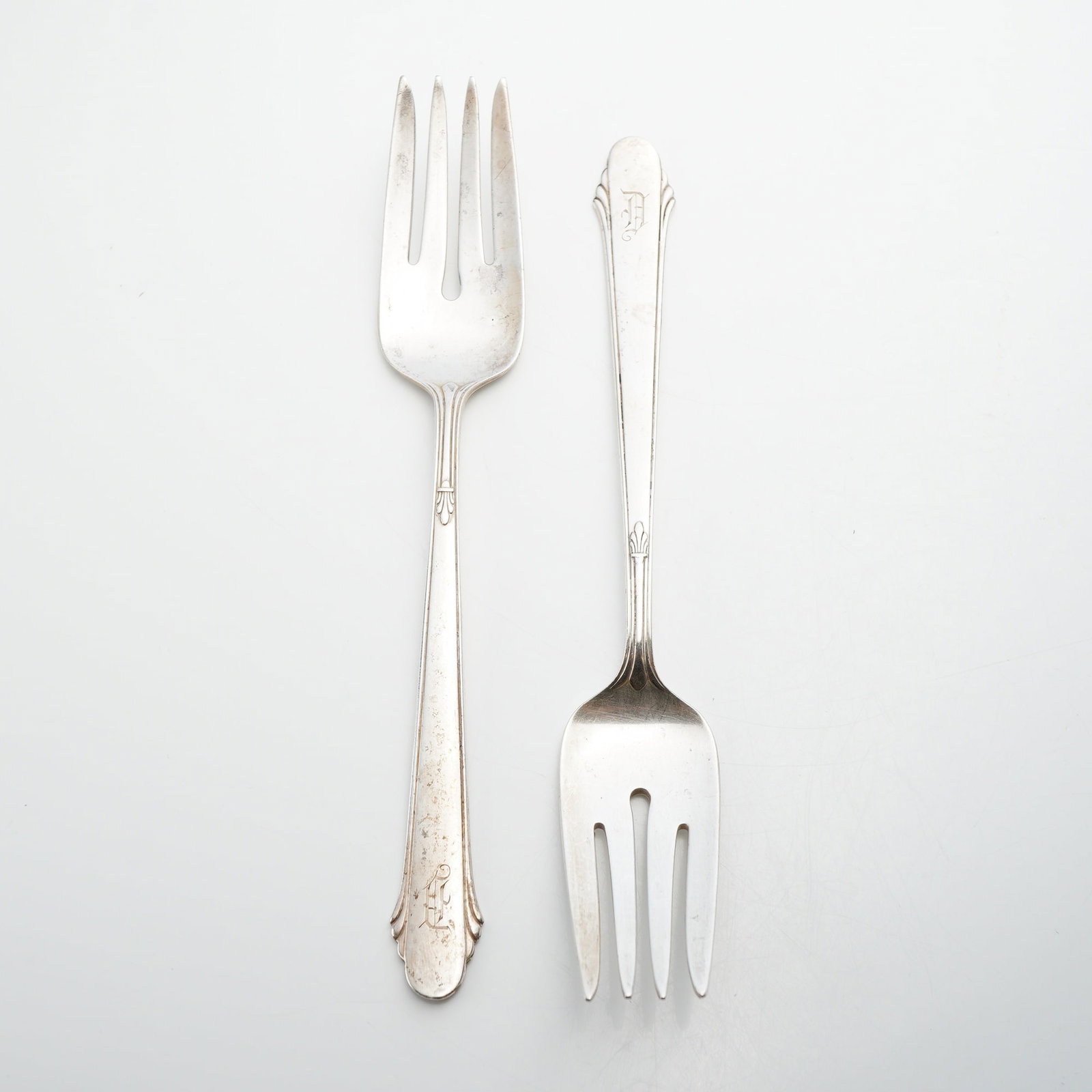 Two Gorham Sterling Silver Forks, Hunt Club Pattern: This lot consists of two sterling silver forks manufactured by the Gorham Manufacturing Company of Providence, Rhode Island. Both pieces feature the Lancaster pattern, which was originally introduced