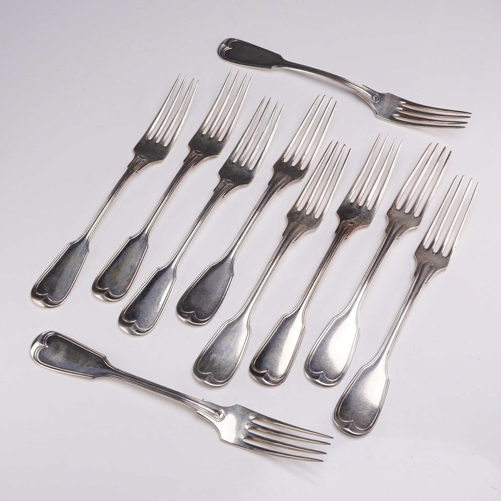 10pc 800 and 13th Loth Silver Dinner Forks: This group features four .812 silver forks and six 800 silver forks. Each fork showcases a heart-shaped motif at the handle. The .812 silver forks are monogrammed on the reverse. Hallmarks include 13 