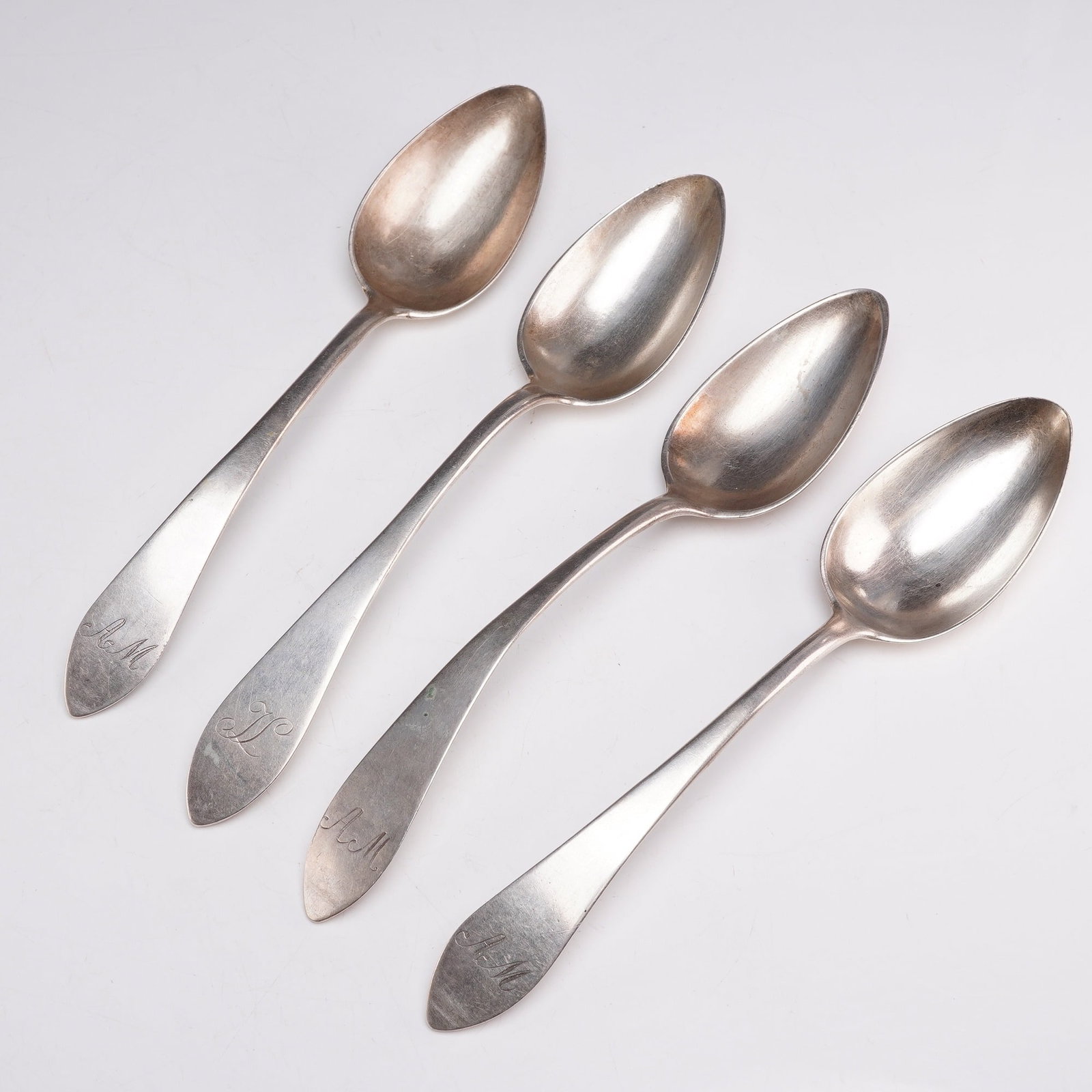 4pc 13th Loth Silver Serving Spoons: A group of four silver serving spoons, each monogrammed on the handle and hallmarked 13 on the reverse. Maker's marks include PM and C.Koch. 13-loth silver being roughly equivalent to 81.25% silver