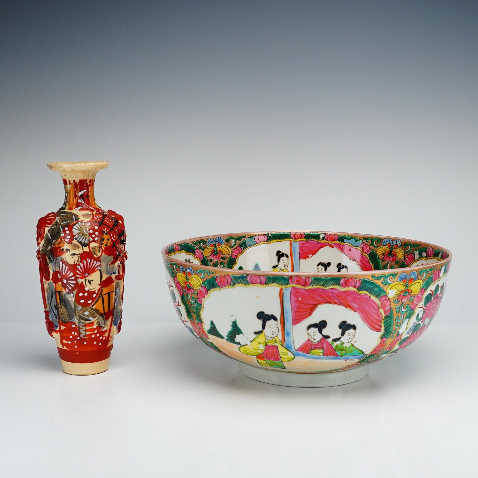 2pc Chinese Hand Painted Bowl and Bud Vase: This lot features a large Chinese hand painted bowl and a decorative bud vase. The porcelain punch bowl is decorated in the classic Rose Medallion pattern, characterized by alternating panels depictin