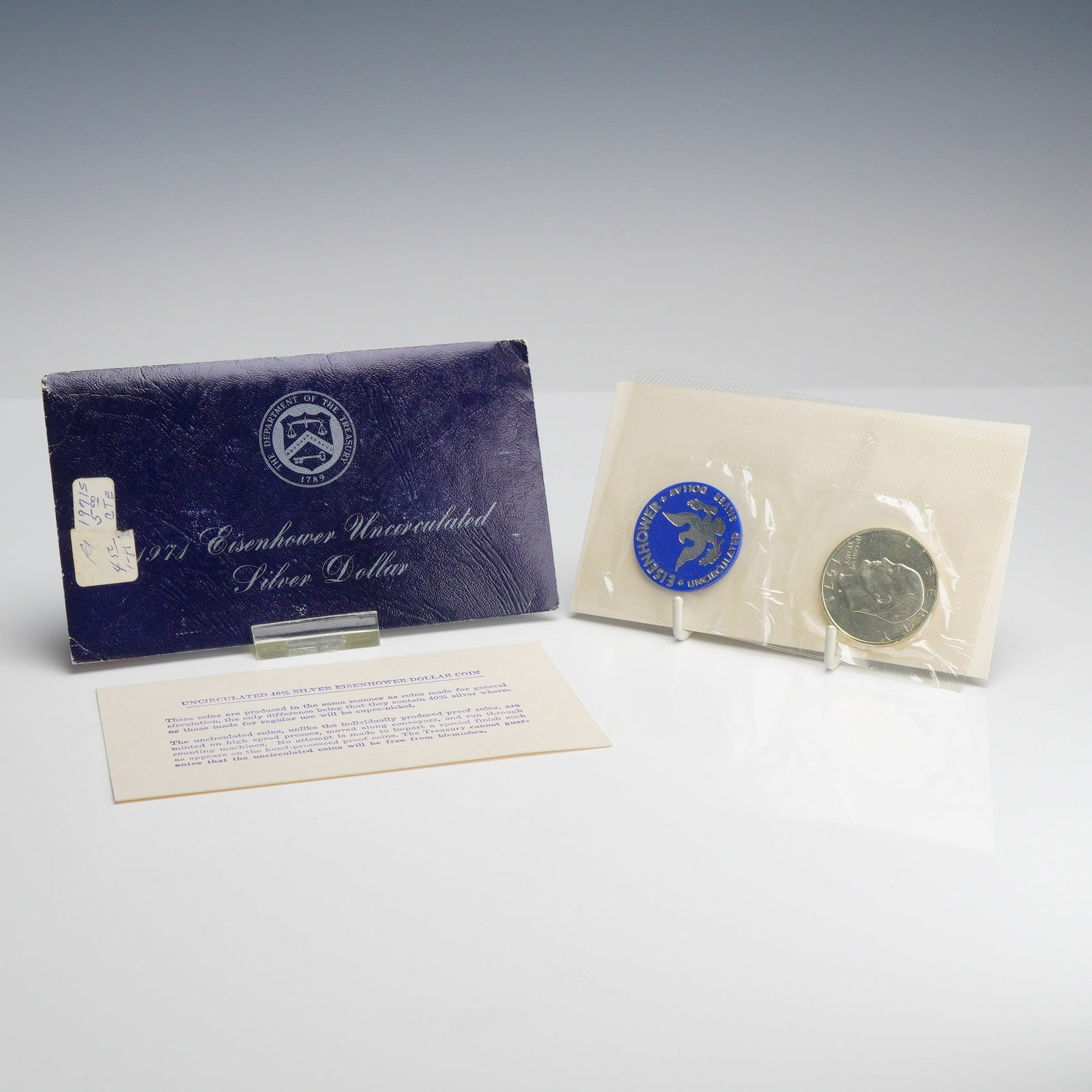 1971-S US Eisenhower 40% Silver Dollar Blue Envelope Mint Set: 1971-S US Eisenhower 40% silver dollar in original government uncirculated packaging, commonly referred to as a Blue Ike. Struck at the San Francisco Mint, the coin features a 40% silver composition (