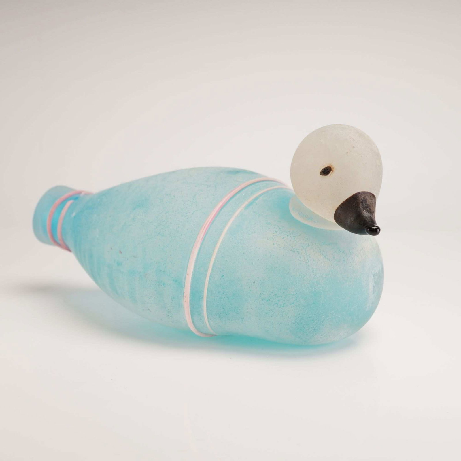 Frosted Art Glass Duck-Form Decorative Vessel: Unusual hand-blown art glass duck-form vessel featuring a frosted "scavo" finish in soft light blue with delicate pink bands accenting the body and tail. This hollow decorative vessel displays an orga