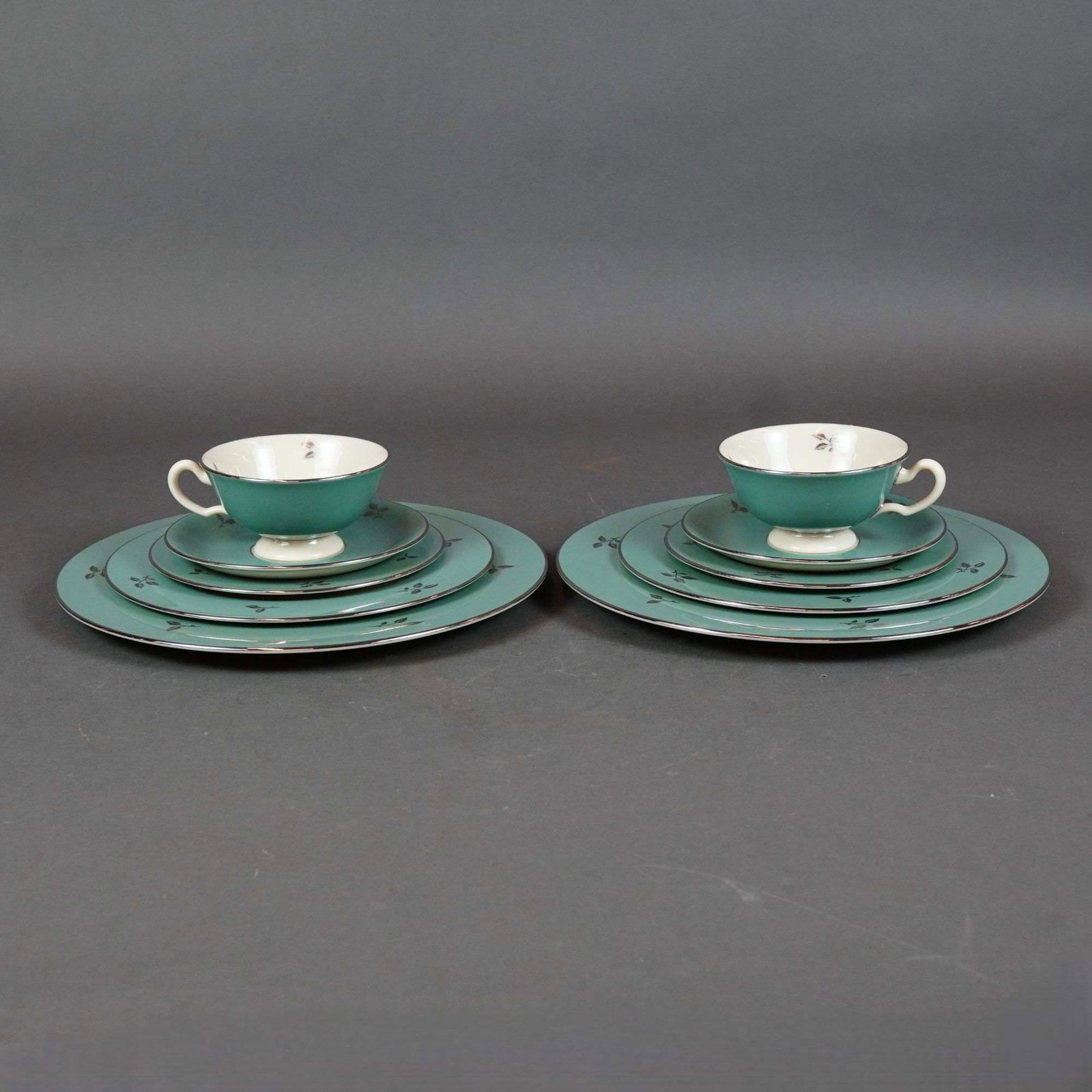 10pc Lenox Porcelain Tea Service Set, Duet: This ten-piece Lenox partial dinner service in the Duet (E 550) pattern features creamy white centers framed by wide teal borders. Each piece is embellished with platinum-finished rims and stylized pl