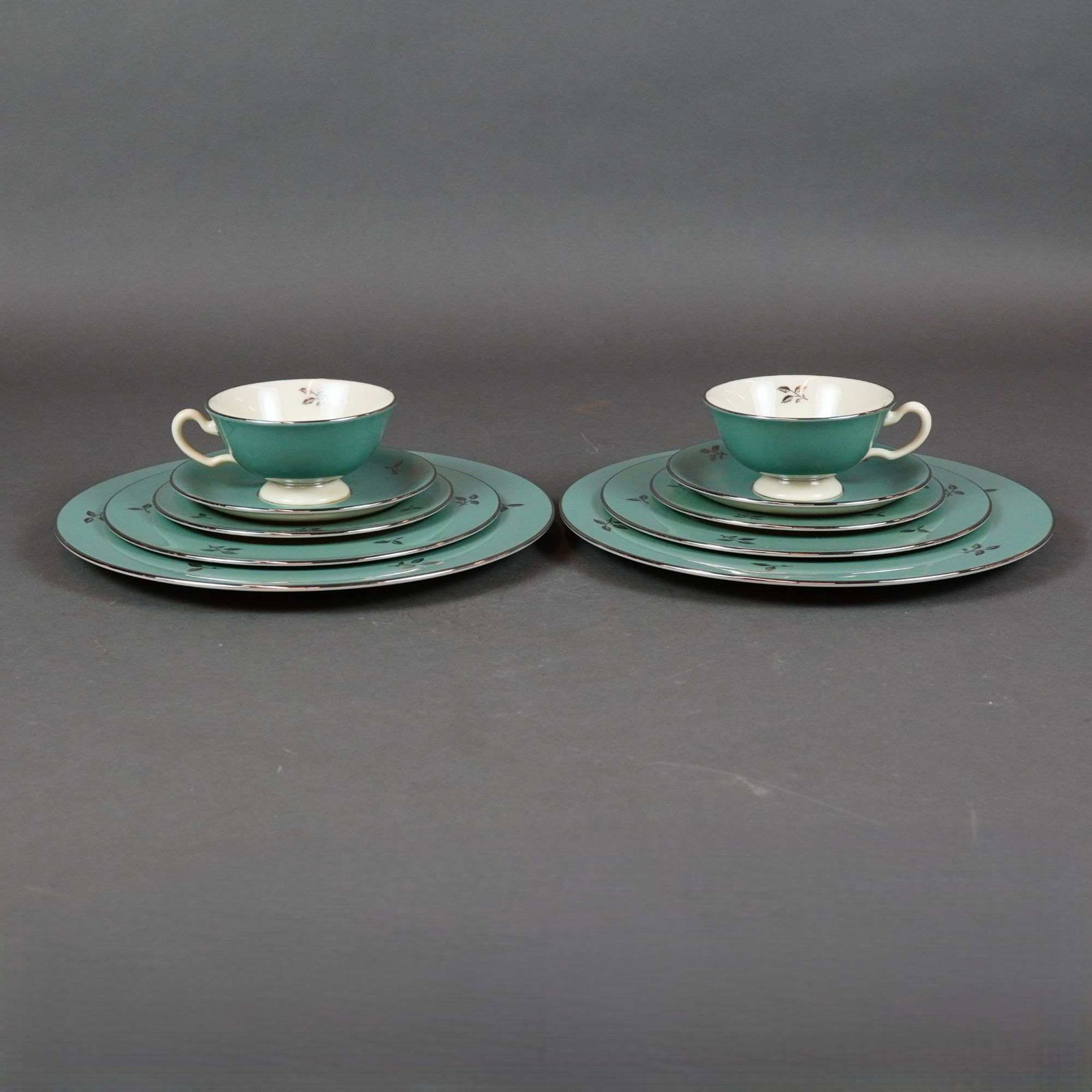10pc Lenox Porcelain Tea Service Set, Duet: This ten-piece Lenox partial dinner service in the Duet (E 550) pattern features creamy white centers framed by wide teal borders. Each piece is embellished with platinum-finished rims and stylized pl