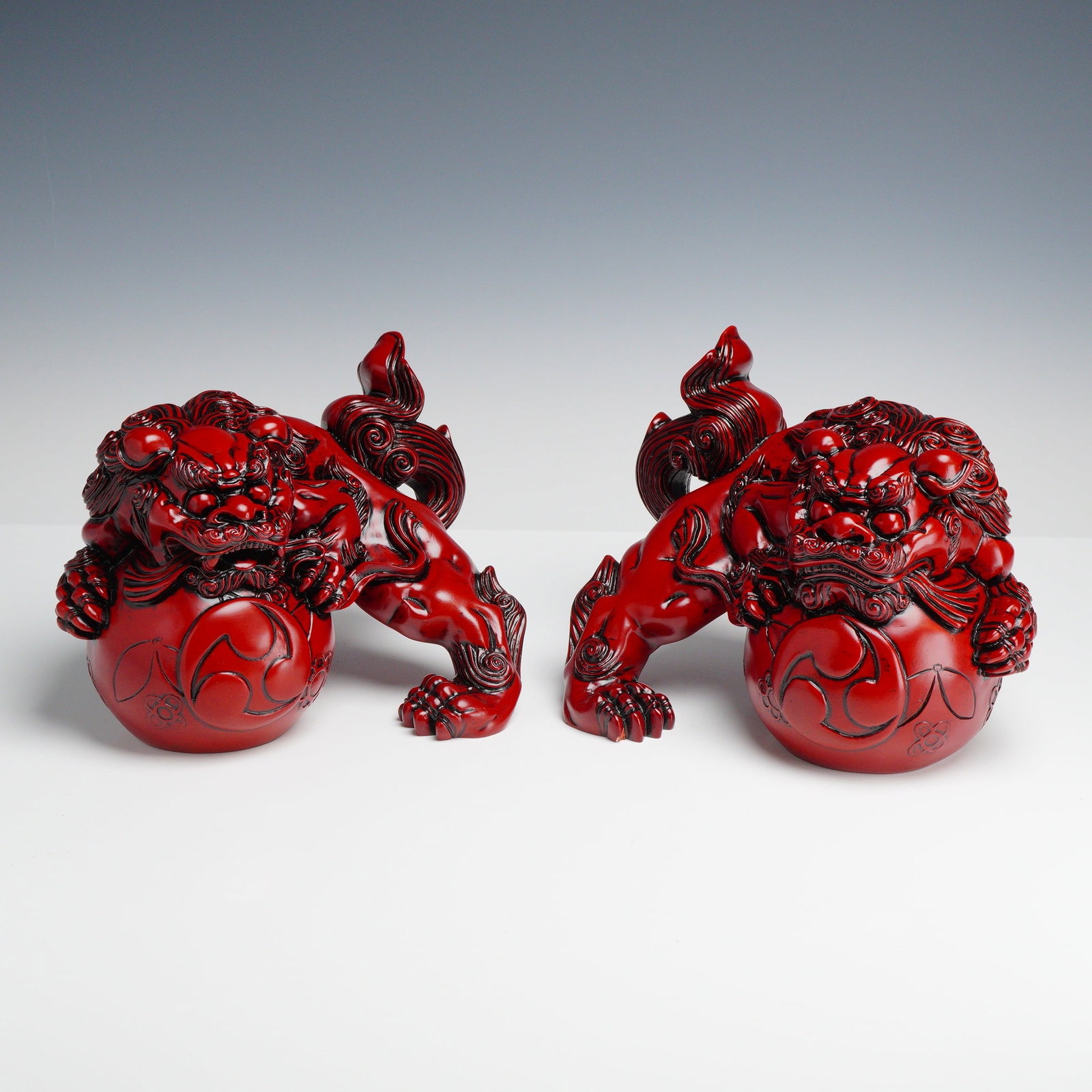 A Pair of Red Cinnabar-Style Resin Chinese Guardian Lions (Foo Dogs) (1 of 3)