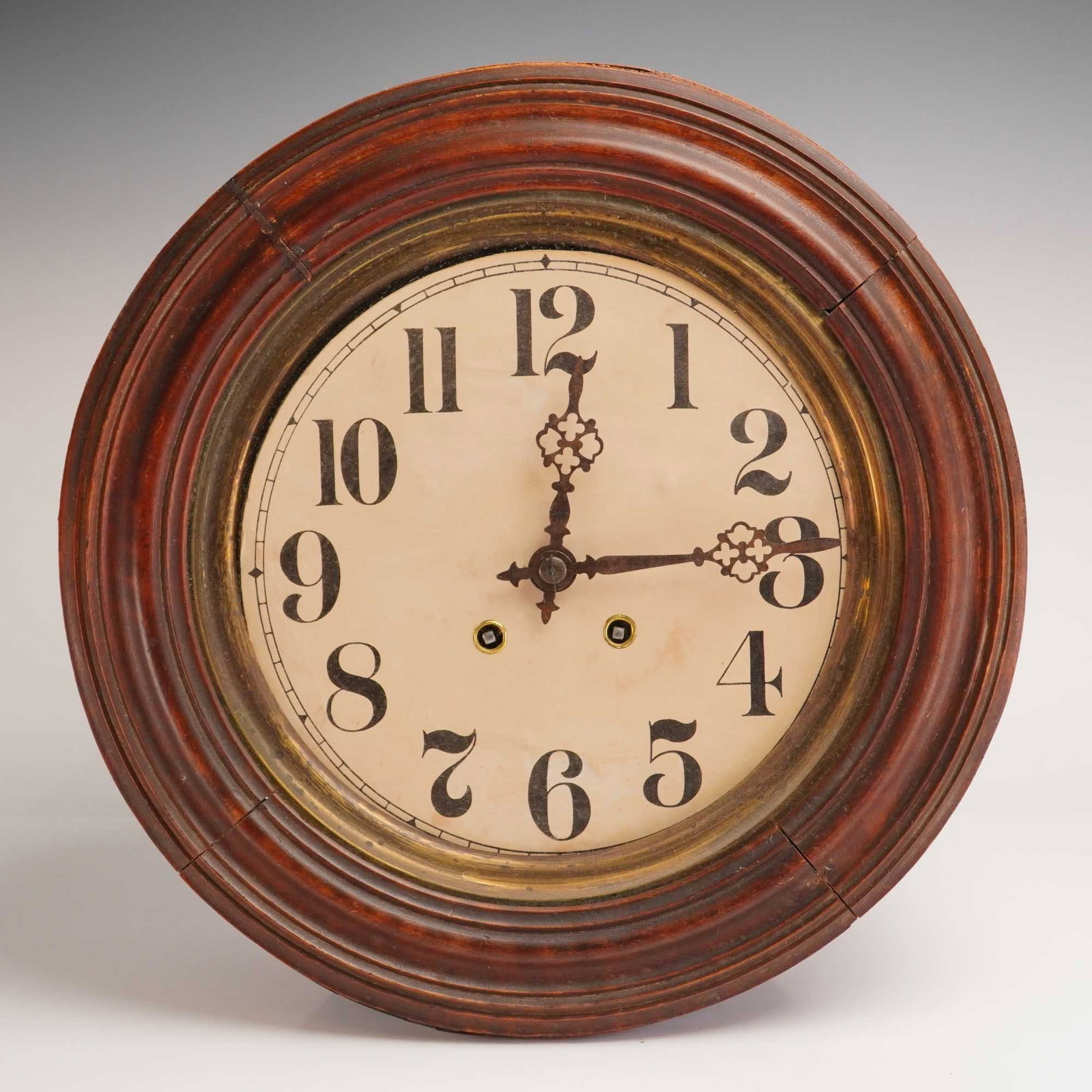 Round Wooden Wall Clock: This wooden wall clock features a round wood frame surrounding a light-colored dial with bold Arabic numerals. The classic design offers a clean, timeless appearance. Weight: 7.12 lb