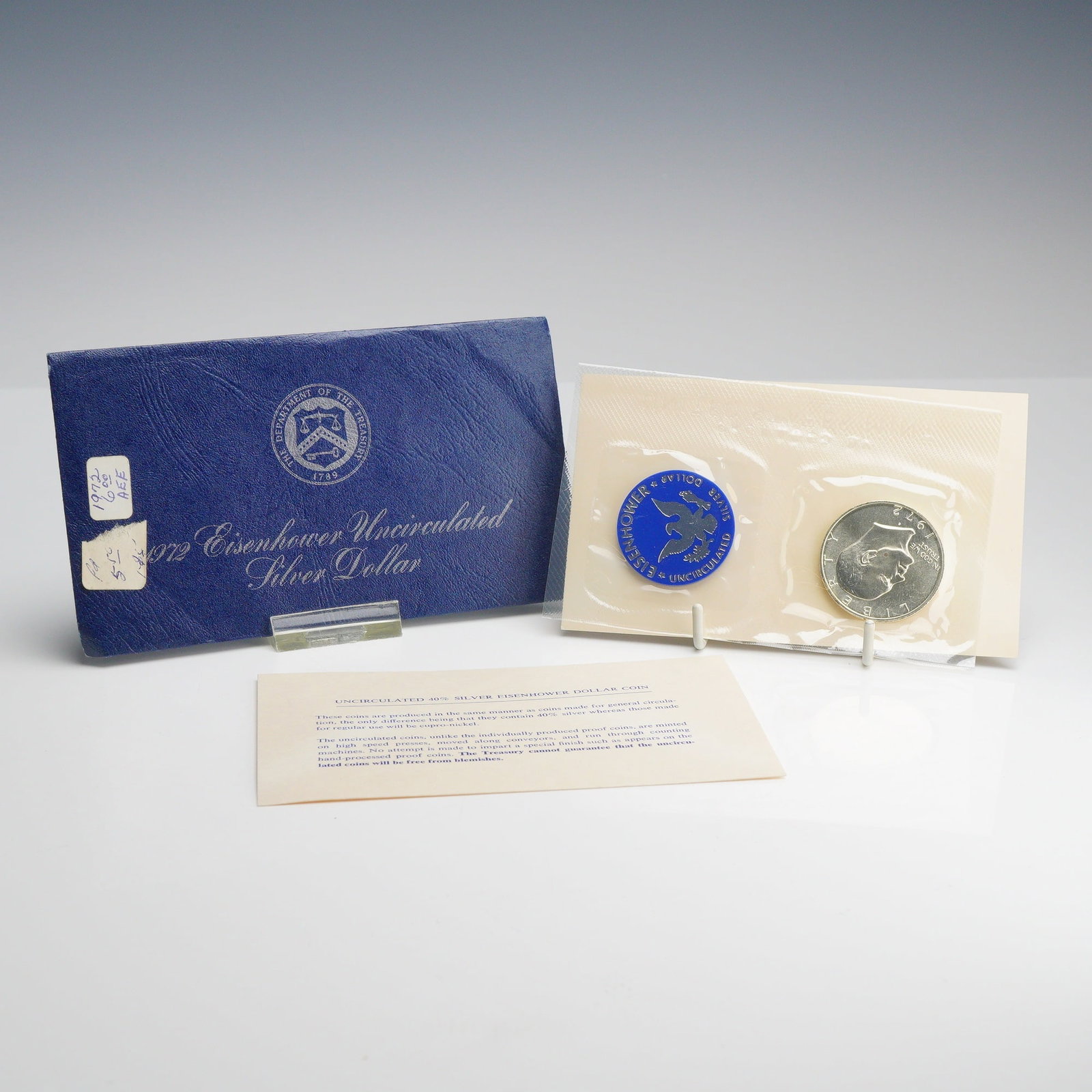 1972-S US Mint Eisenhower 40% Silver Dollar Blue Envelope Uncirculated: A 1972-S Eisenhower 40% silver dollar, struck at the San Francisco Mint. This specimen is part of the uncirculated silver dollar series issued by the US Mint, commonly referred to by collectors as a B