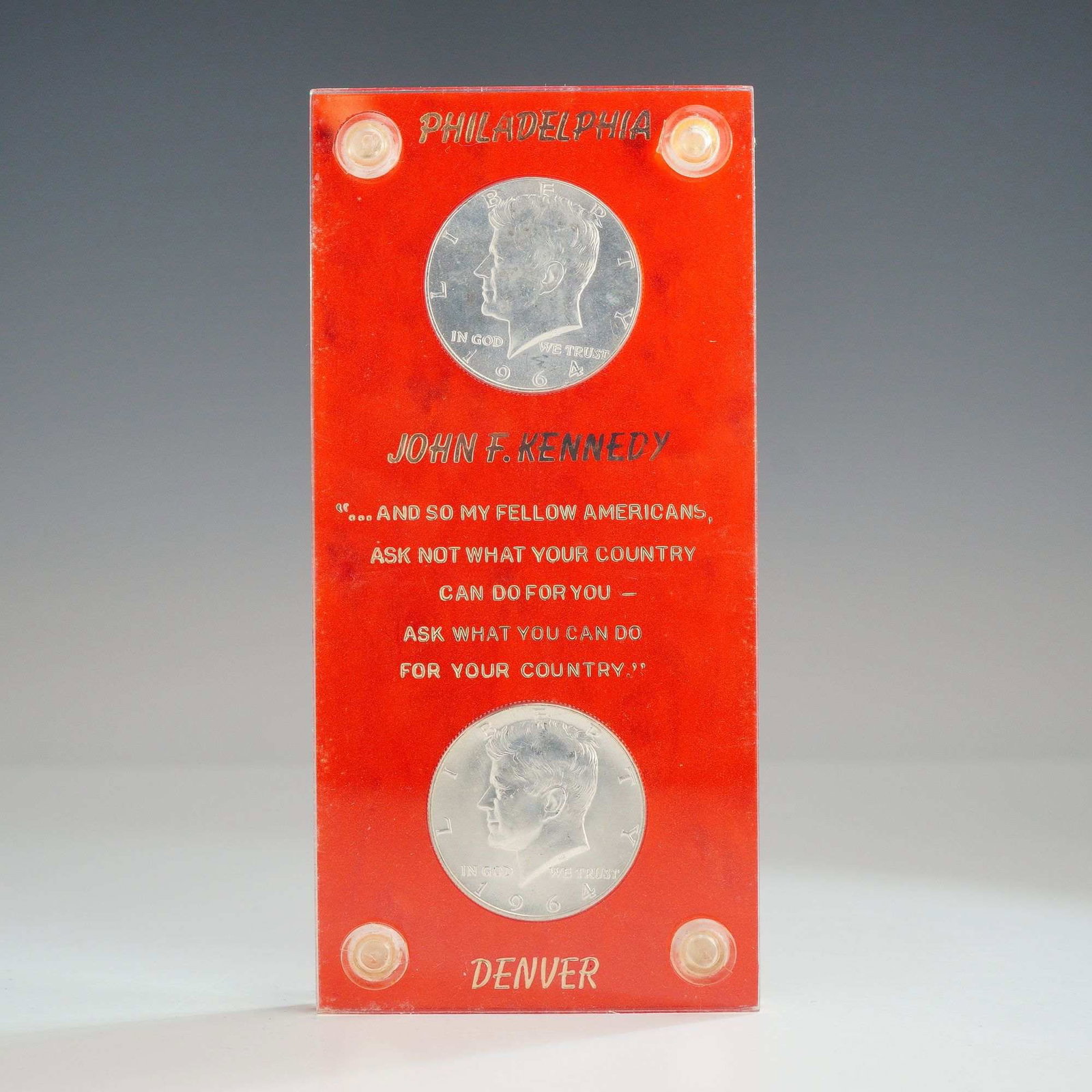 A Pair of US 1964 Kennedy Silver Half Dollars: A pair of US 1964 Kennedy half dollars (KM# 202), featuring one specimen from the Philadelphia mint and one from the Denver mint. Each coin is struck in 90% silver with a reeded edge and features the 