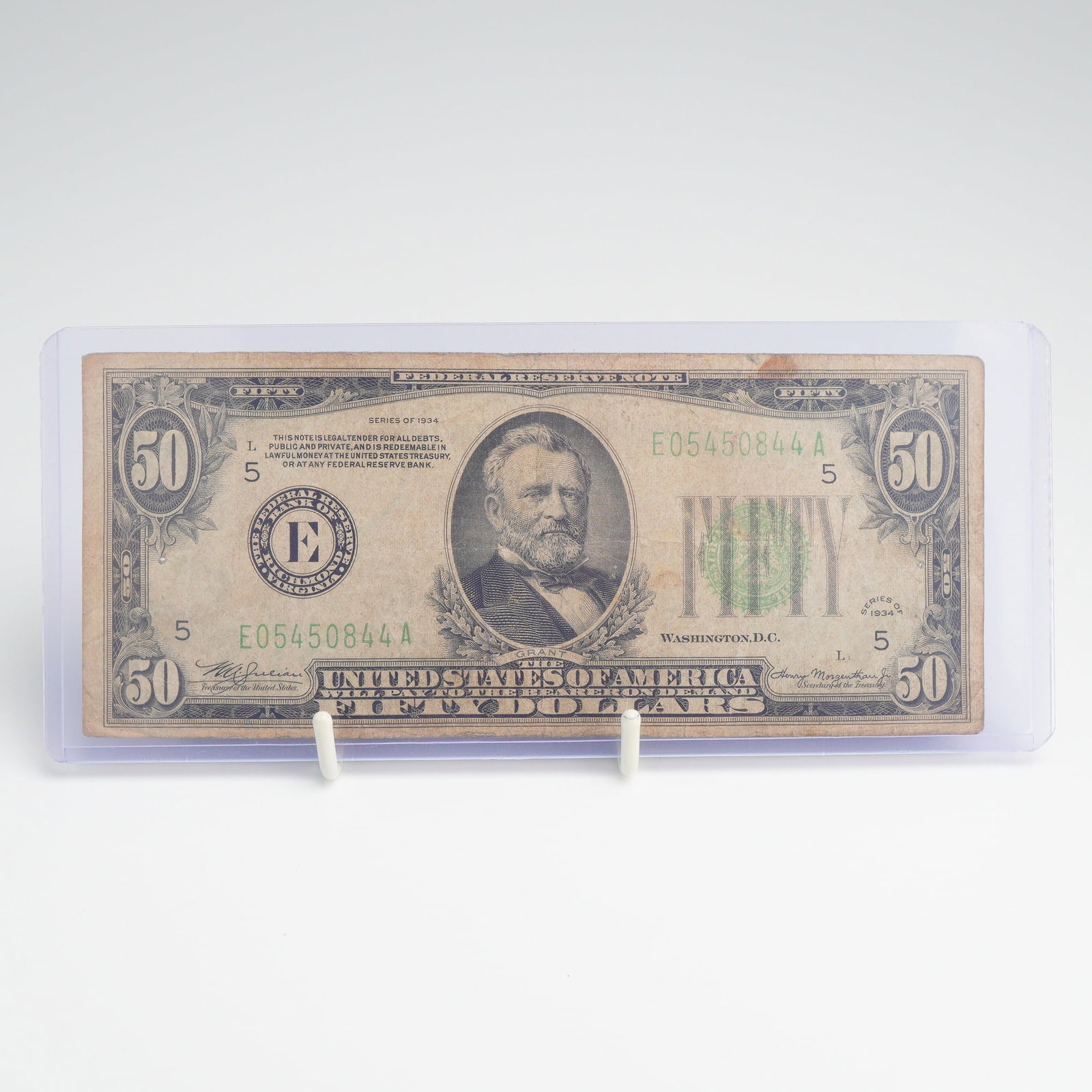 US Series 1934 $50 Federal Reserve Note Richmond: This vintage US currency bill $ 50.00 is a Series of 1934 Federal Reserve Note issued through the Federal Reserve Bank of Richmond, Virginia, indicated by the regional seal letter E and the number 5. 