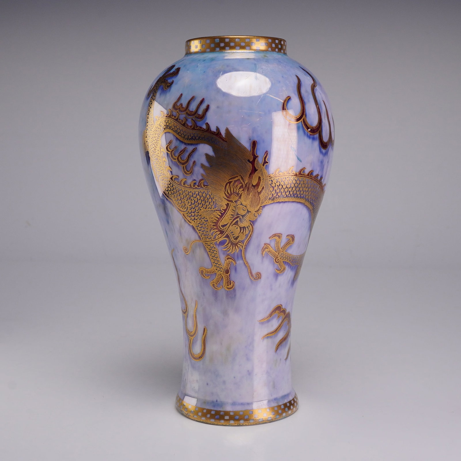 Wedgwood Fairyland Luster Dragon Vase, Z4829: This porcelain baluster-form vase is an example of Wedgwood luster ware, specifically the Dragon Luster pattern. The vessel features a high, rounded shoulder and a flared foot, finished in a mottled m