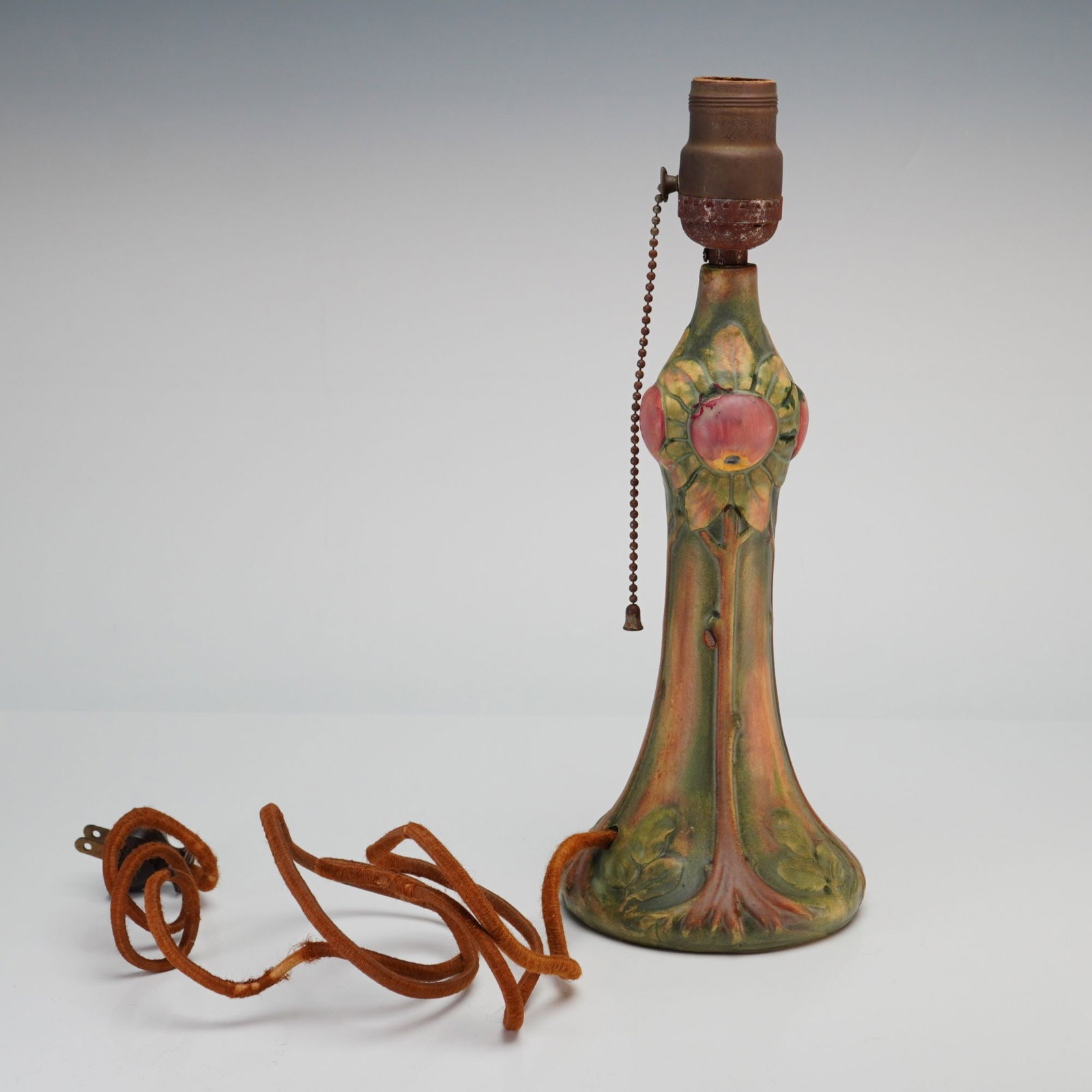 Weller Pottery Apple Tree Table Lamp, Baldin Pattern: An American art pottery table lamp base produced by Weller Pottery in the Baldin pattern. The earthenware body features a flared, organic base that tapers into a slender neck and a bulbous upper