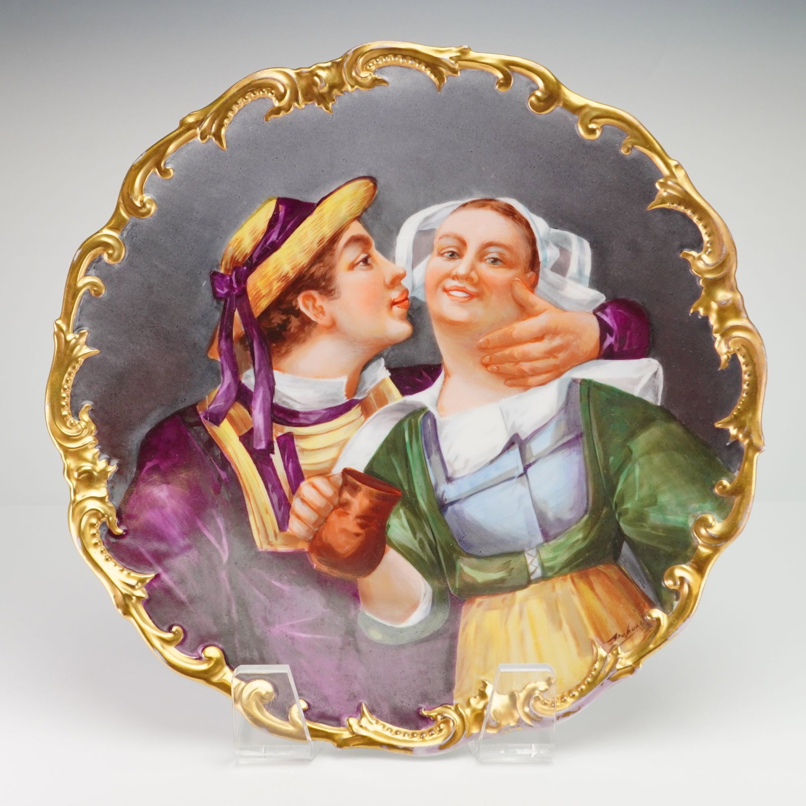 Large LS&S Limoges Porcelain Hand Painted Wall Plate Signed Dubois: A large, circular porcelain wall plate or charger manufactured in Limoges, France, and distributed by the firm Lewis Straus & Sons (LS&S). The central scene shows a man in 17th-century style dress, in