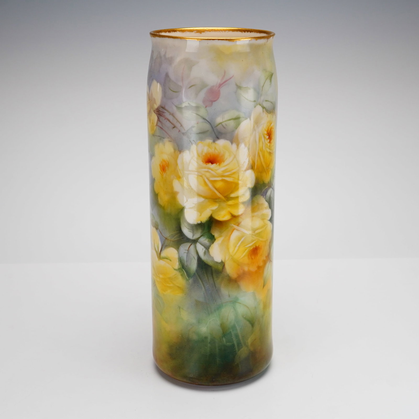 Belleek Hand Painted Floral Porcelain Vase Signed M. L. Choate: This Belleek vase features a thin, translucent body with a short neck and a gold-gilded rim. The exterior is hand-painted in a naturalistic style with a motif of large, multi-petaled yellow roses in v