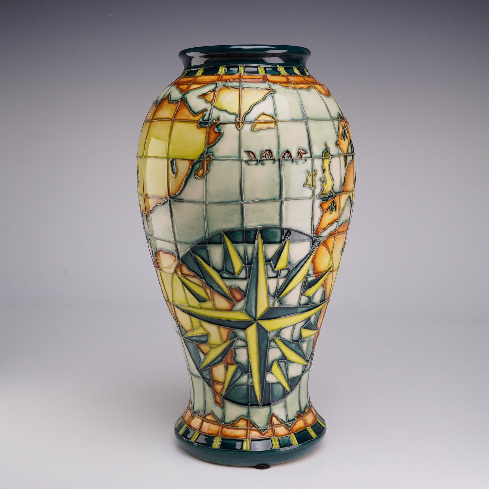 Moorcroft Pottery by Alicia Amison Vase, Globe Pattern: A Moorcroft earthenware vase of baluster form featuring the Odyssey pattern designed by Alicia Amison for the Moorcroft Collectors Club. The exterior is decorated using the tubelining technique, depic