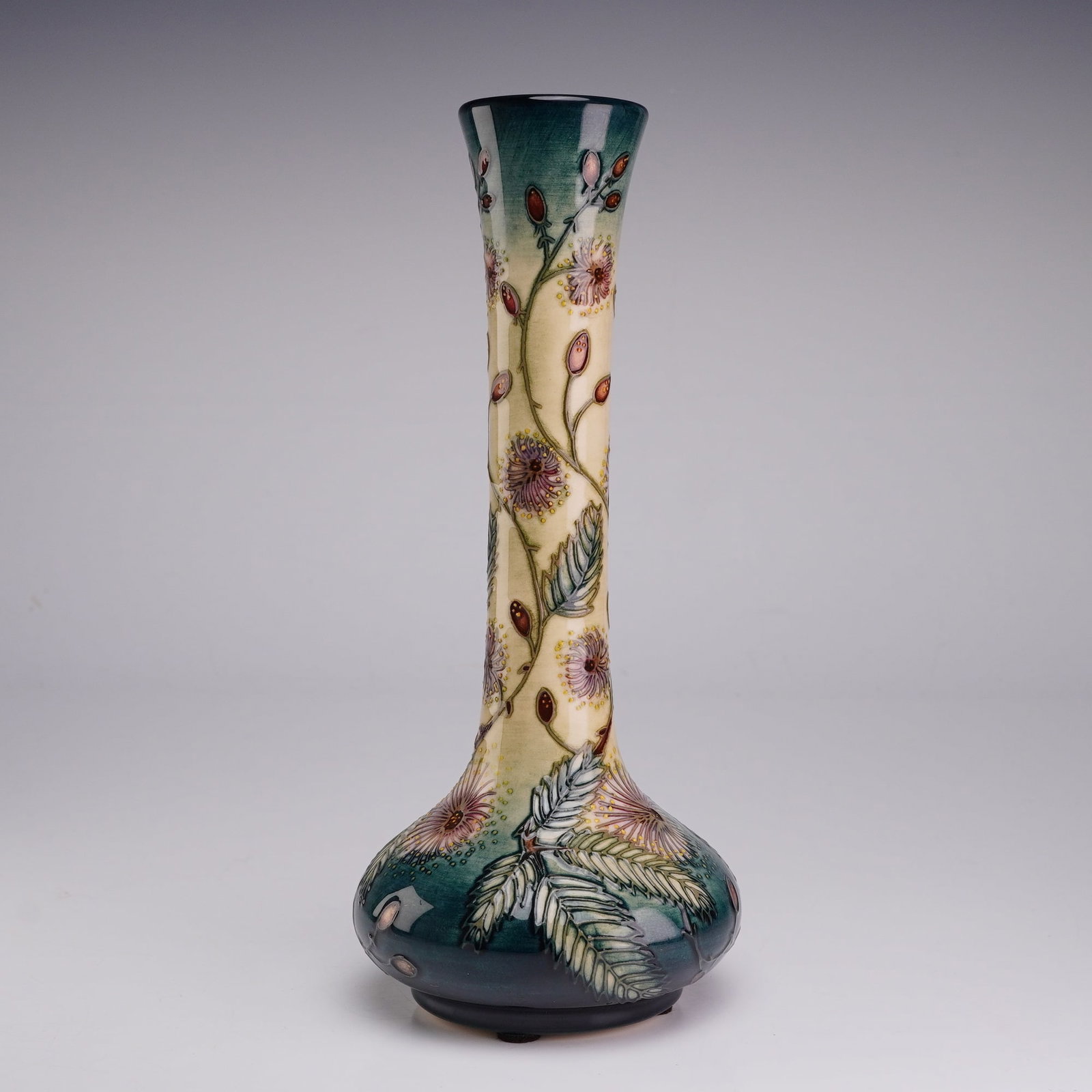 Moorcroft Pottery by Rachel Bishop Slender Bottle Vase, Ryden Lane: A Moorcroft pottery vase decorated in the Ryden Lane pattern designed by Rachel Bishop. The earthenware vessel features a tall slender neck on a bulbous base, decorated using the tube-lining technique