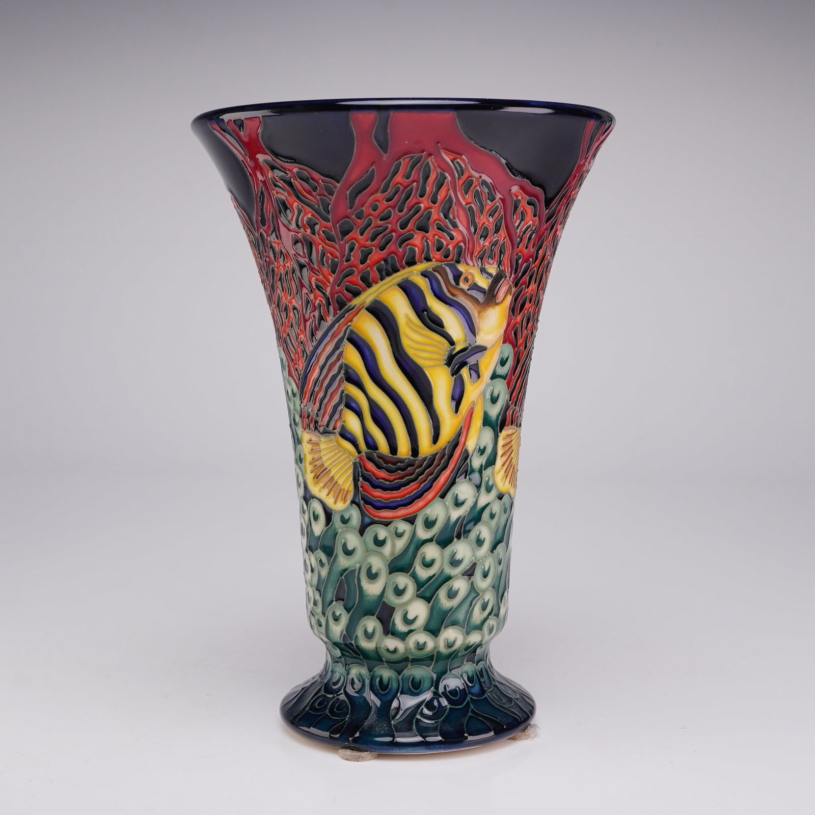 Moorcroft Pottery Earthenware Vase, Catch Me If You Can Pattern: A Moorcroft Pottery trumpet-shaped earthenware vase decorated in the Catch Me If You Can pattern, designed by Shirley Hayes. The exterior features a vibrant marine scene executed with signature tube-l