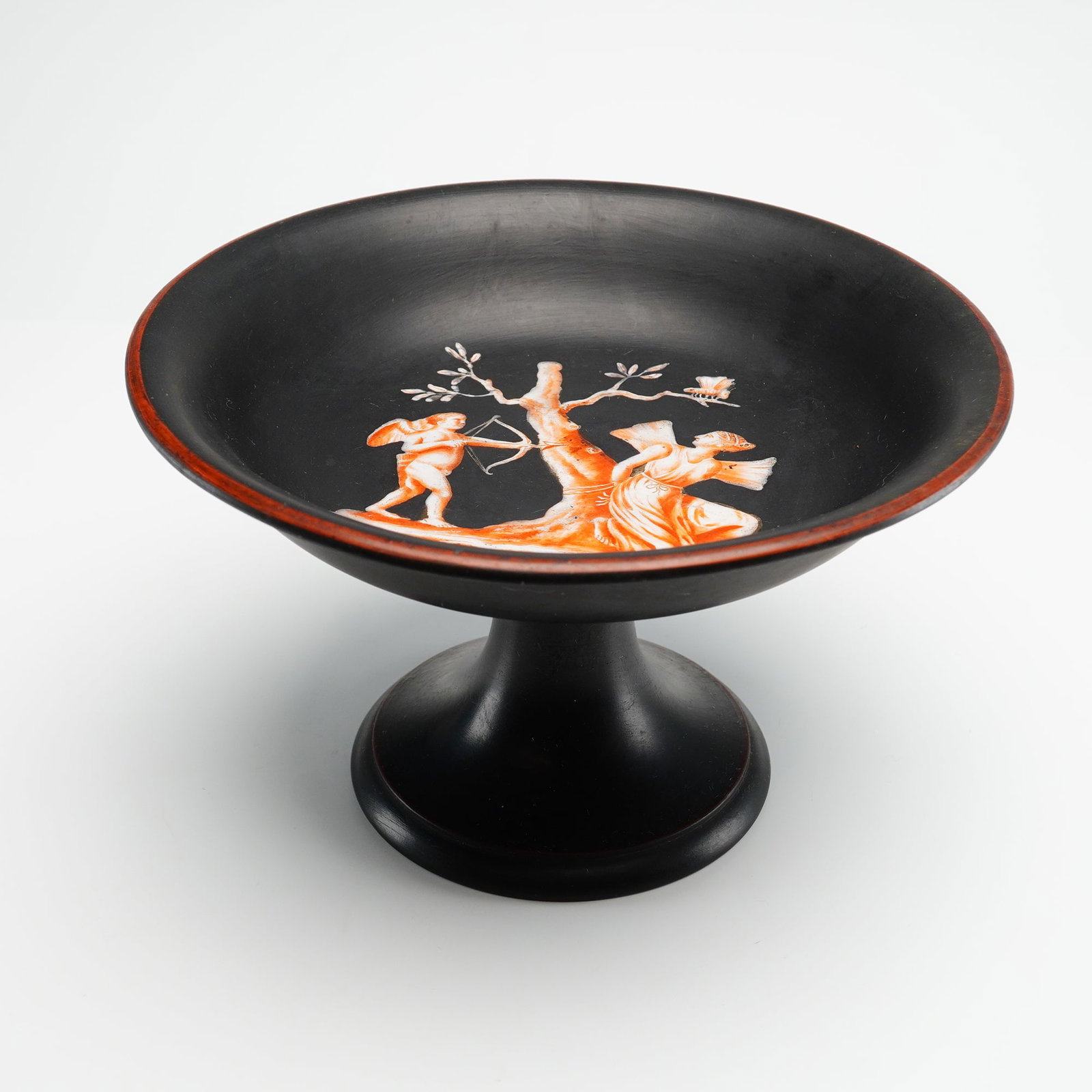 Wedgwood Black Basalt Decorated Pedestal Bowl: A Wedgwood black basalt pedestal bowl featuring hand-painted encaustic decoration in the neoclassical style. This wide, shallow compote is supported by a flared circular foot. The interior center is d