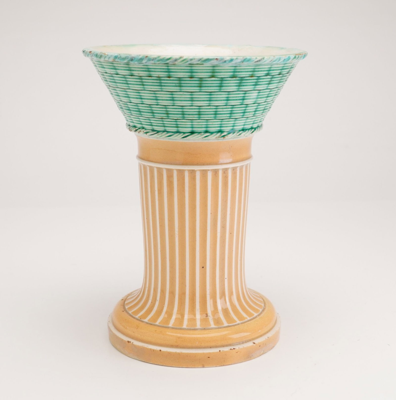 Wedgwood Tri-Color Pearlware Vase: A Wedgwood pearlware ceramic vessel, identified as a mystery vase, originating from Staffordshire, England, circa 1800. The item is constructed in two primary sections. The upper portion consists of a