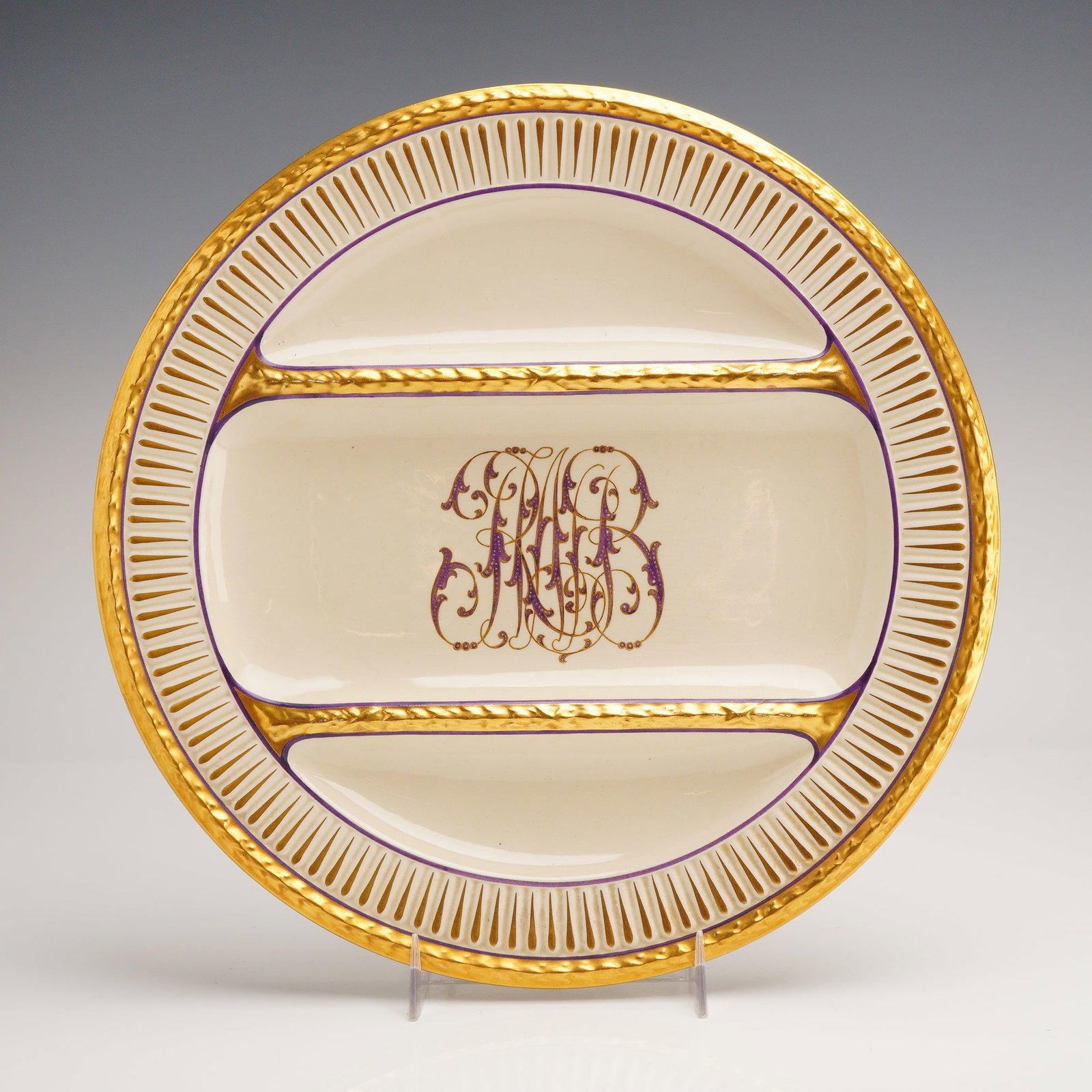 Wedgwood Monogrammed Divided Earthenware Plate for Charles R. Lynde: A fine Wedgwood cream-glazed earthenware divided plate, produced at the Etruria works in England. The circular form is partitioned into three horizontal compartments by raised, heavily gilded, and tex