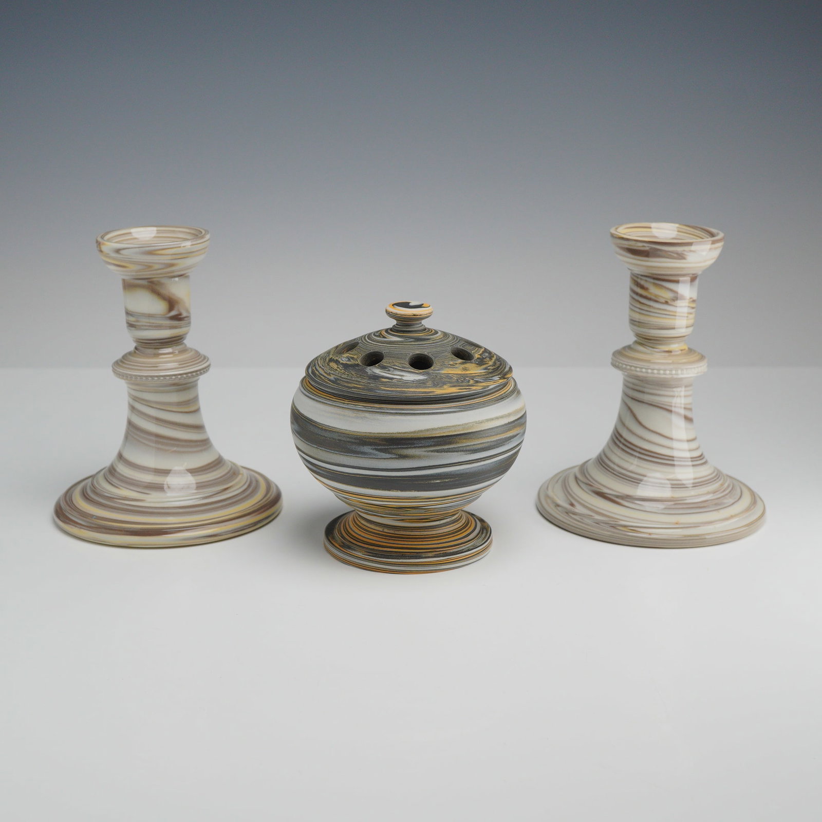 3pc Wedgwood Agateware Set, Flower Frog and Candlesticks: This three piece set of Wedgwood ceramic ware is produced in the traditional agateware style, also known as variegated pebble ware. The set consists of a pair of candlesticks and a globular flower fro