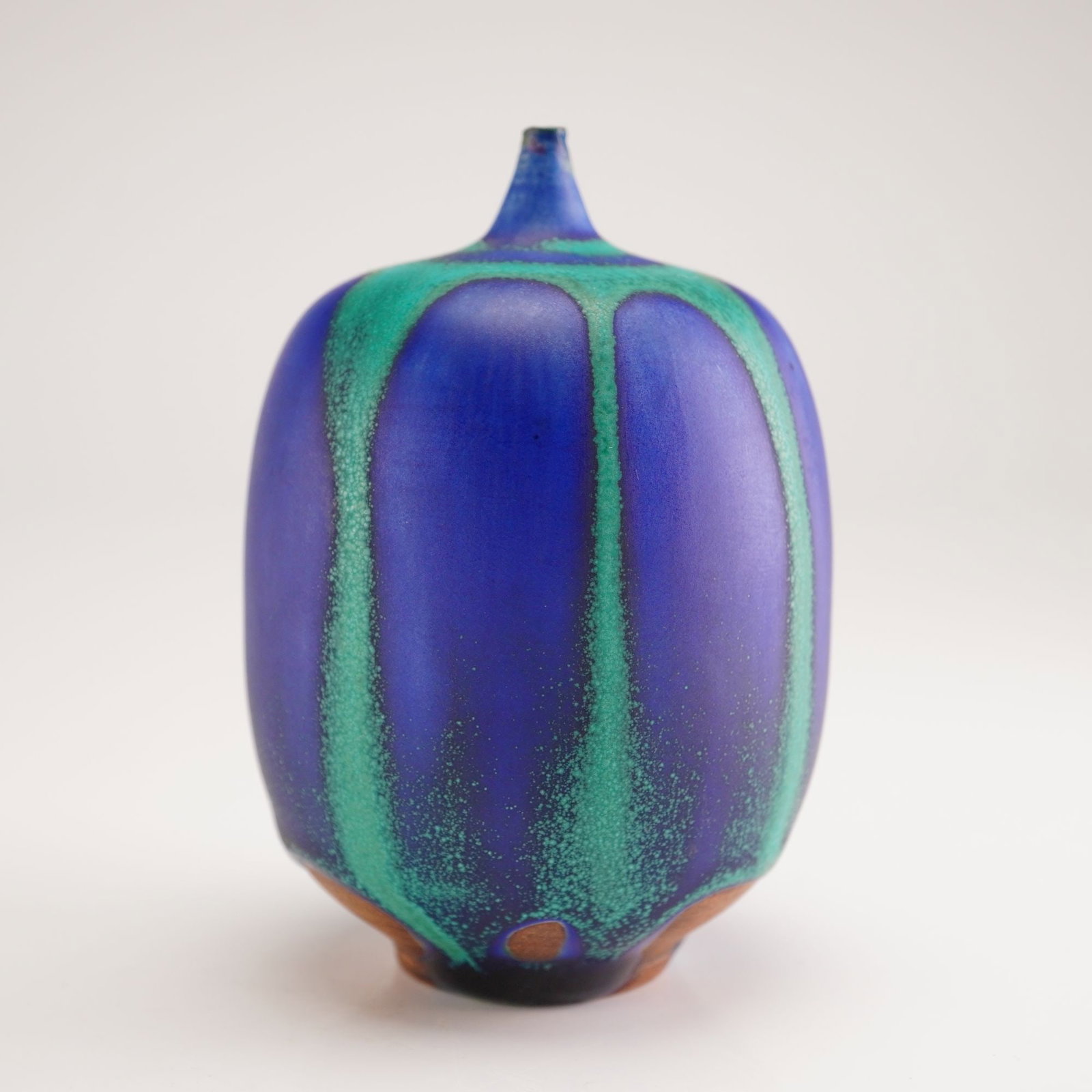 Rose Cabat (American, 1914-2015) Blue and Green Feelie Vase: Studio ceramic vase by Rose Cabat, rendered in layered hues of blue and green with the artist's signature soft, tactile "Feelie" form. Signed on the base "Cabat." Cabat is celebrated in mid-century Am