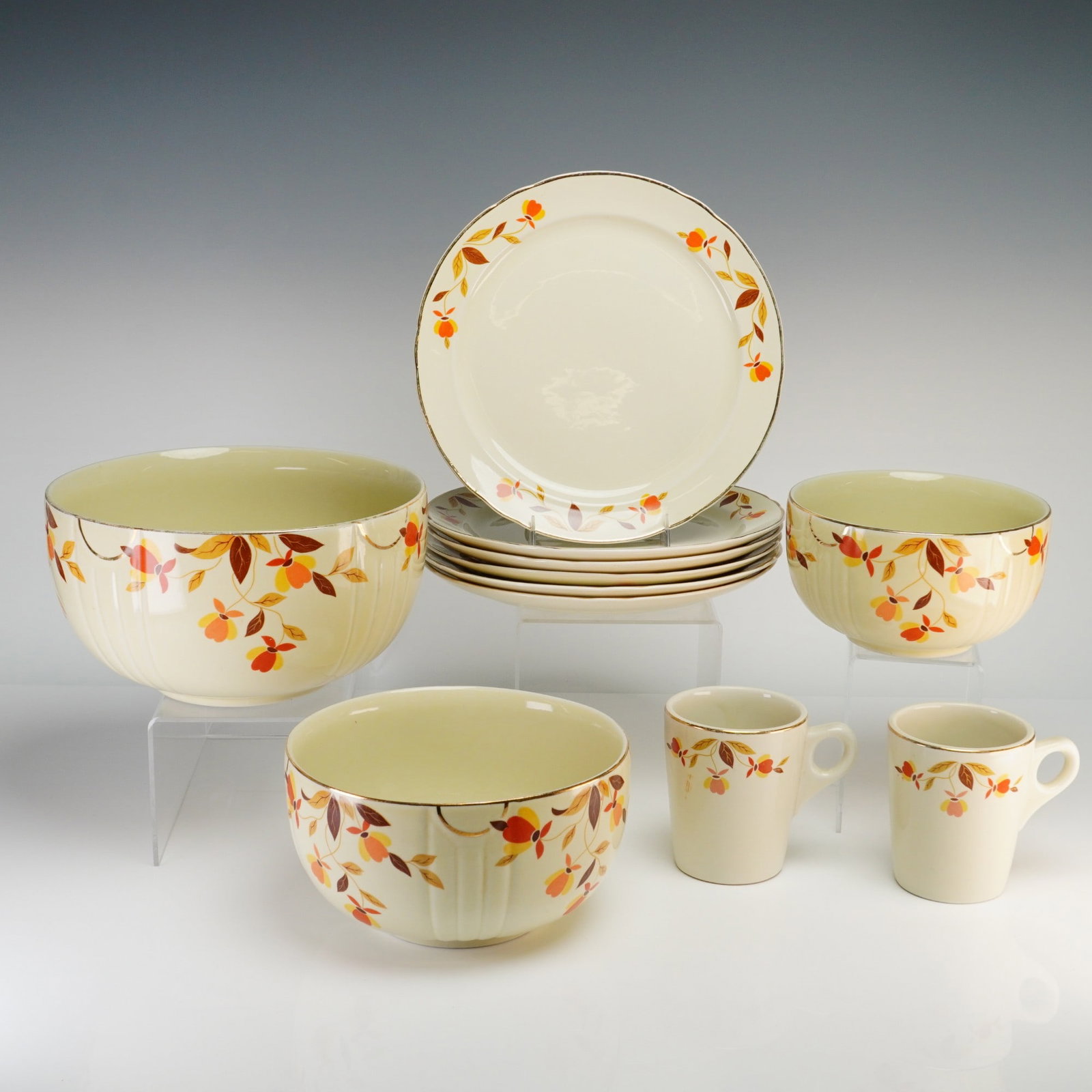 Set of 11 Hall China Ceramic Tableware, Autumn Leaf Pattern: This collection of ceramic kitchenware is manufactured by the Hall China Company in the Autumn Leaf pattern, originally produced for the Jewel Tea Company. The set is constructed from refined earthenw